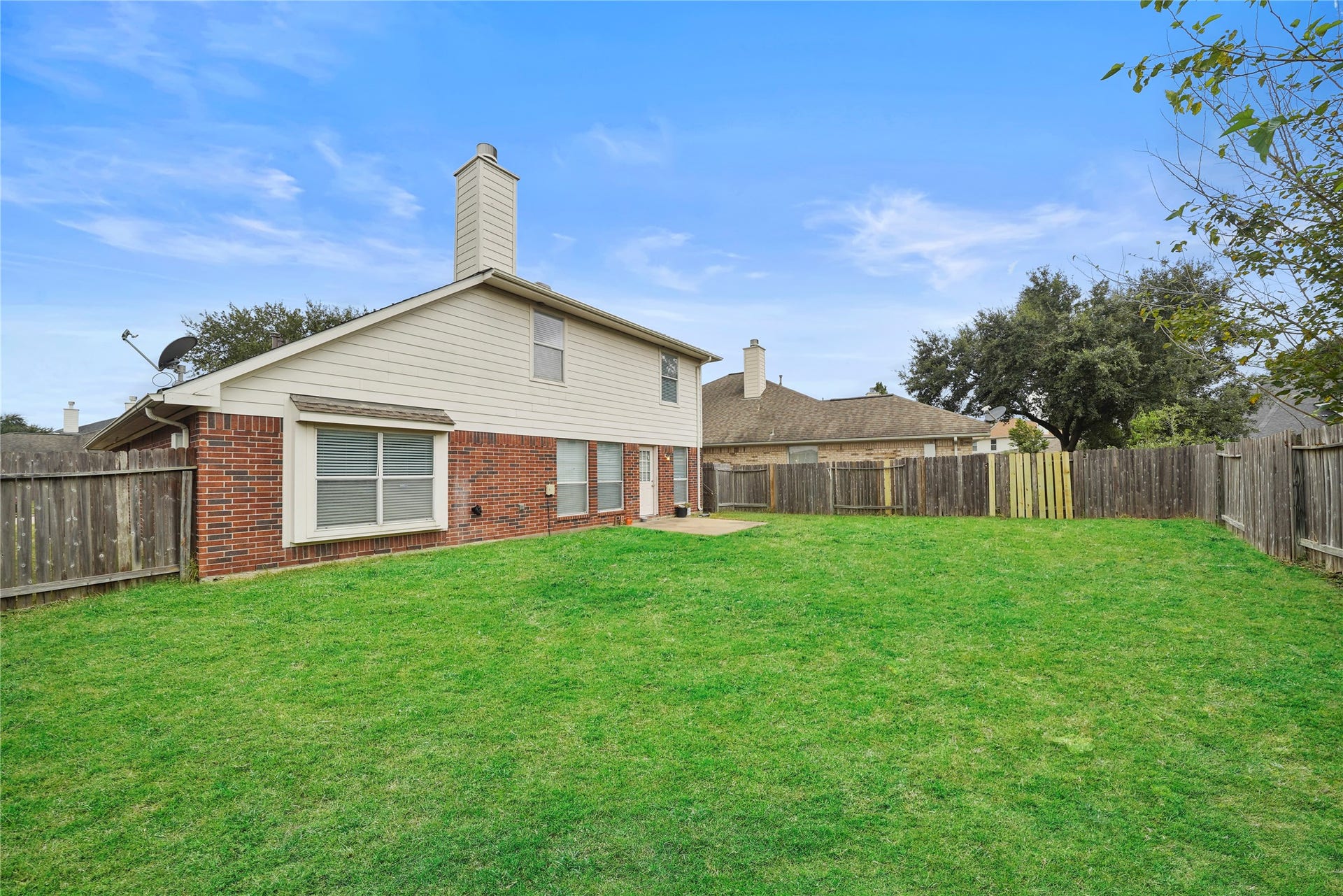 5614 Gaffney Lane, Houston, TX 77084 The fenced backyard opens to a broad lawn, giving you the perfect beginning for the outdoor gathering space or backyard oasis you have been imagining.