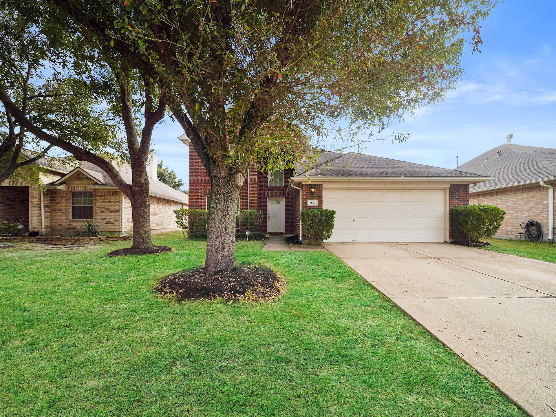 5614 Gaffney Lane, Houston, TX 77084 One final look at the curb appeal, paired with fresh paint, roof maintenance completed in October 2026, and updated AC components: attic unit replaced in August 2025 and exterior condenser in June 2026.