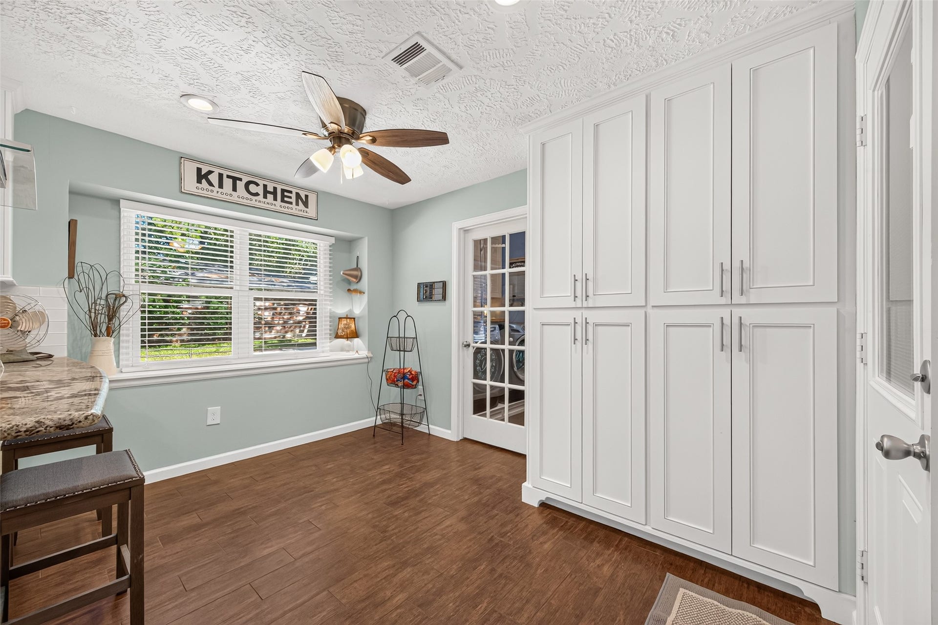 1535 Memorial Drive, Conroe, TX 77304 SPACIOUS PANTRY WITH DRAWERS THAT SLIDE OUT FOR YOUR CAN GOODS; GLASS DOOR LEADS INTO THE LAUNDRY ROOM AND A DOOR TO THE PATIO; SPACIOUS BREAKFAST ROOM WITH LOTS OF NATURAL LIGHT