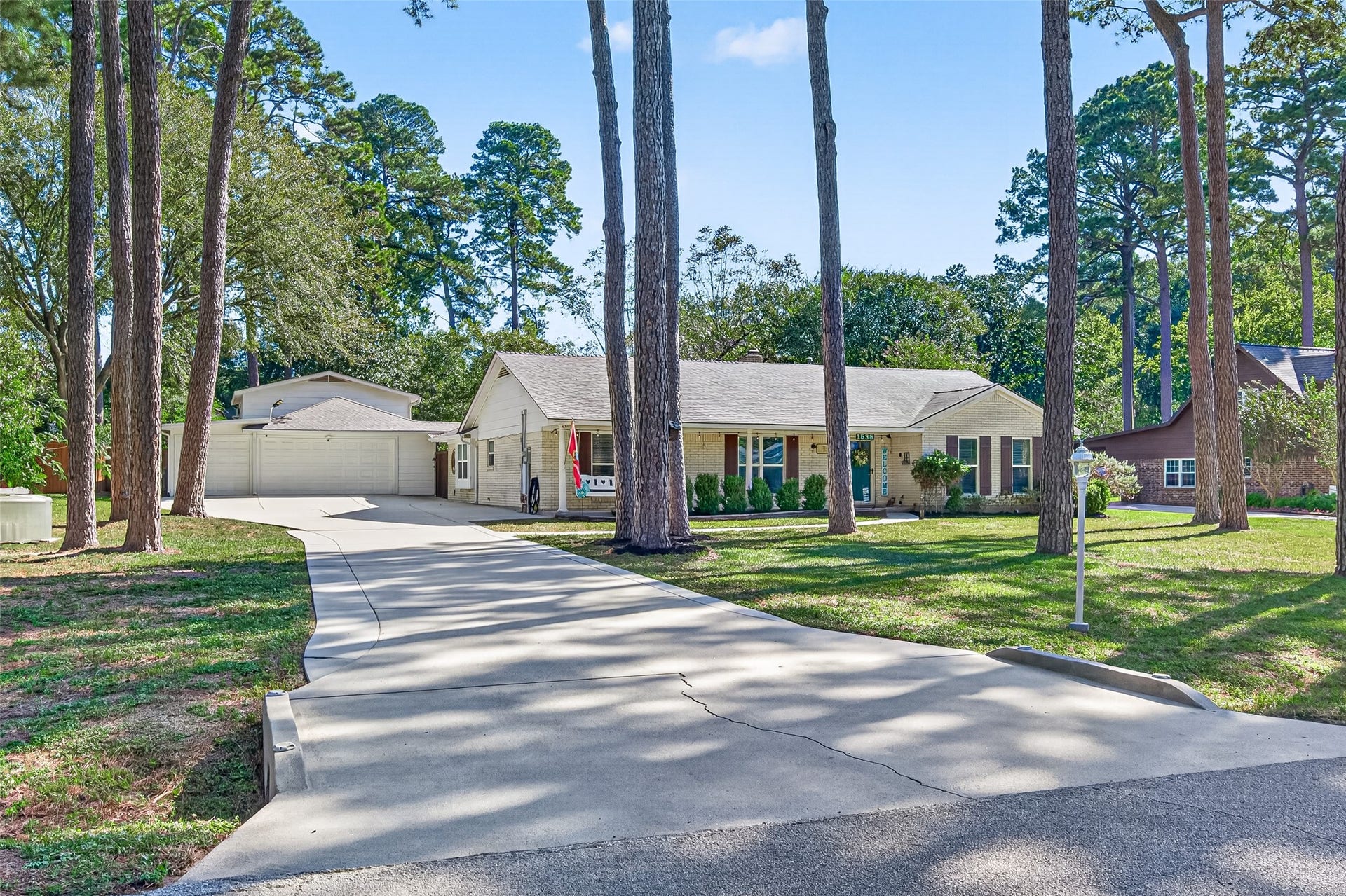 1535 Memorial Drive, Conroe, TX 77304 THE DRIVEWAY HAS BEEN WIDENED TO MAKE MORE ROOM FOR MORE PARKING
