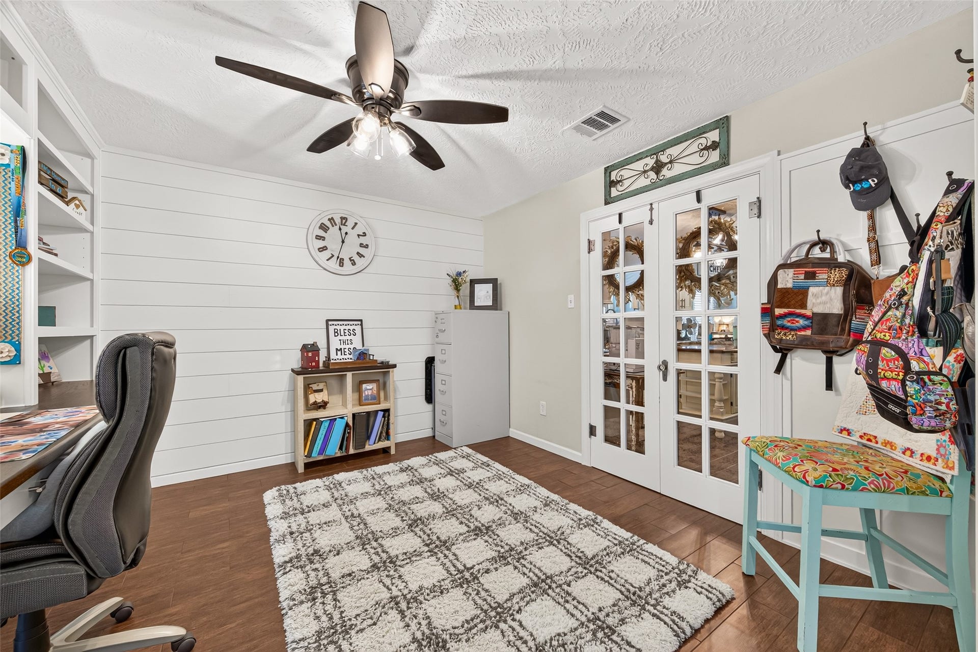 1535 Memorial Drive, Conroe, TX 77304 THE CUSTOM CORNER WAS MADE FOR HANGING ITEMS ON, ADDED A SHIPLAP ACCENT WALL, BEAUTIFUL TILE FLOORS AND THE VINTAGE DOUBLE GLASS DOORS WERE MY GRANDMOTHERS (IN HER HOME); I HAD THEM REFURBISHED AND INSTALLED; ALL ORIGINAL HARDWARD TO THE DOOR AND THE GLASS DOOR KNOW; ADDED A CEILING FAN