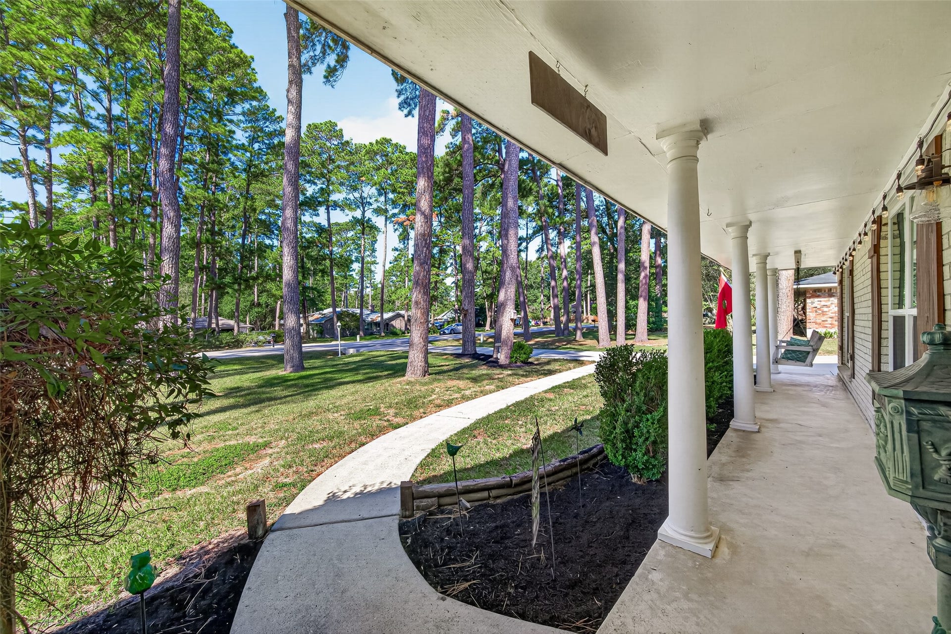1535 Memorial Drive, Conroe, TX 77304 LARGE FRONT PORCH TO DECORATE FOR HOLIDAYS; THE LIGHTS CAN BE CHANGE TO DIFFERENT COLORS TOO