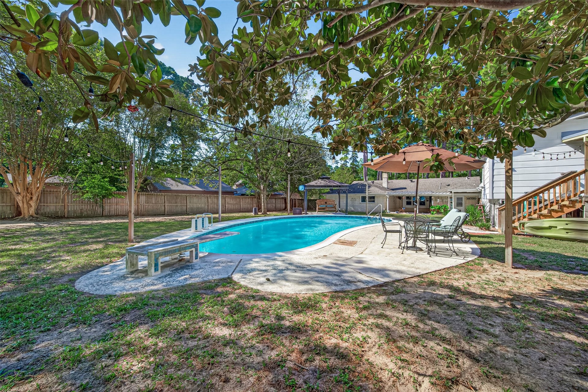 1535 Memorial Drive, Conroe, TX 77304 ANOTHER VIEW OF THE BEAUTIFUL BACKYARD, POOL AND ENTRY TO THE POOL HOUSE! THIS BACKYARD OFFERS SO MUCH SPACE TO ENTERTAIN FAMILY AND FRIENDS. THE POOL IS 9FT DEEP.