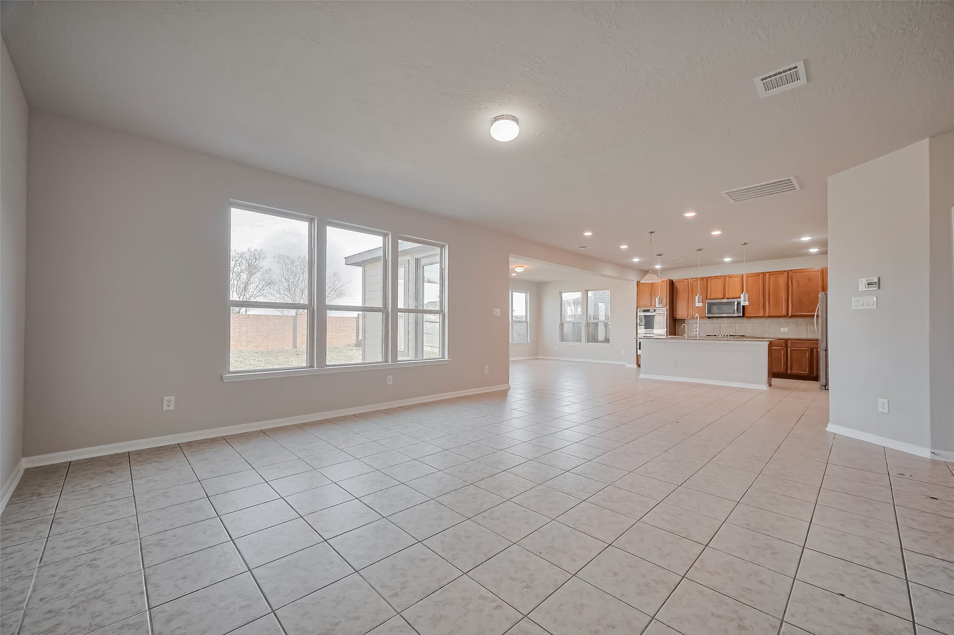 24114 Morrison Lane, Katy, TX 77493 open concept living room with attached kitchen.
