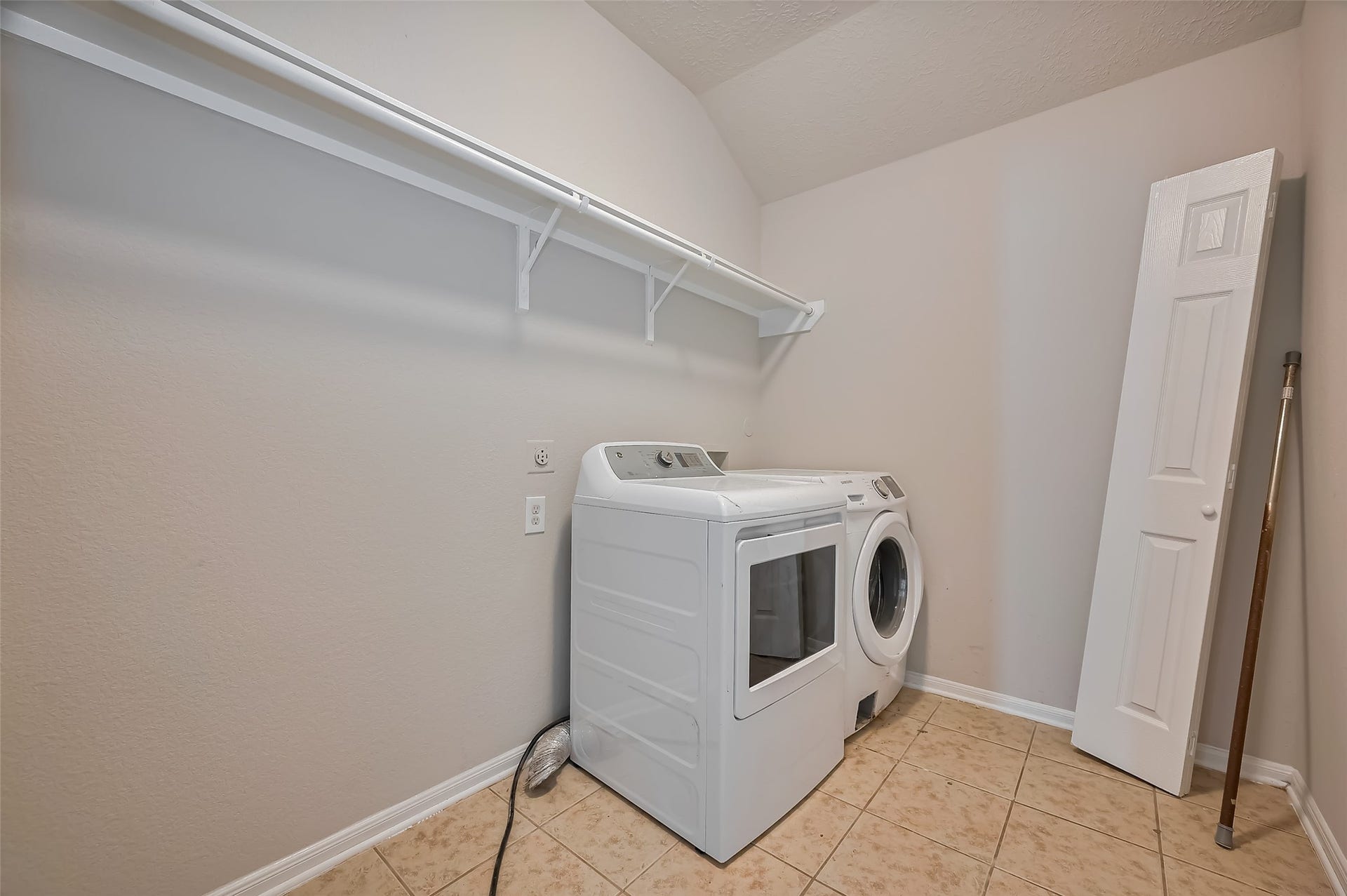 24114 Morrison Lane, Katy, TX 77493 Laundry space features washer and dryer & a built-in shelf.