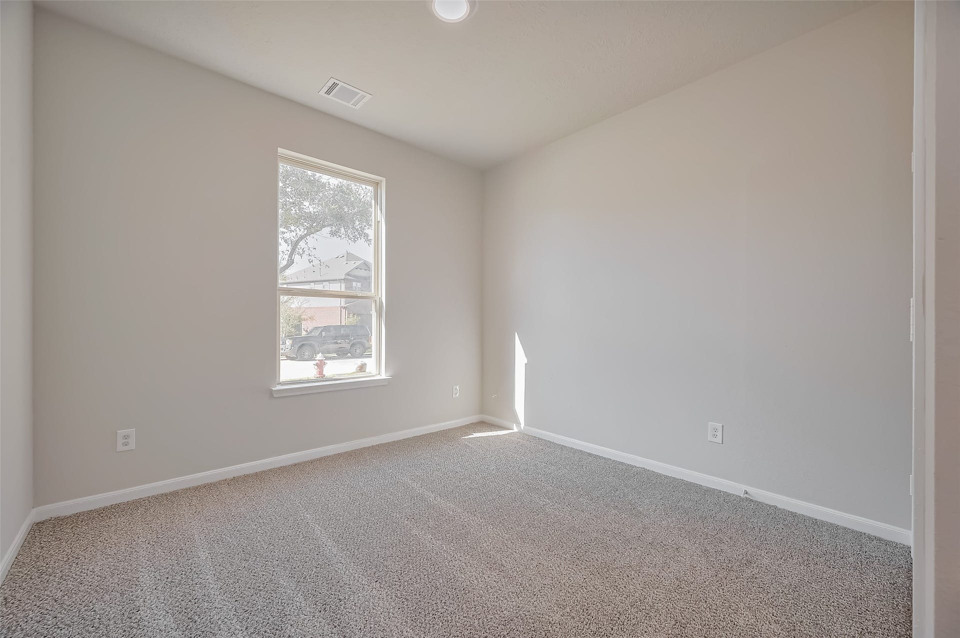 24114 Morrison Lane, Katy, TX 77493 Bedroom features carpet floor and a window.