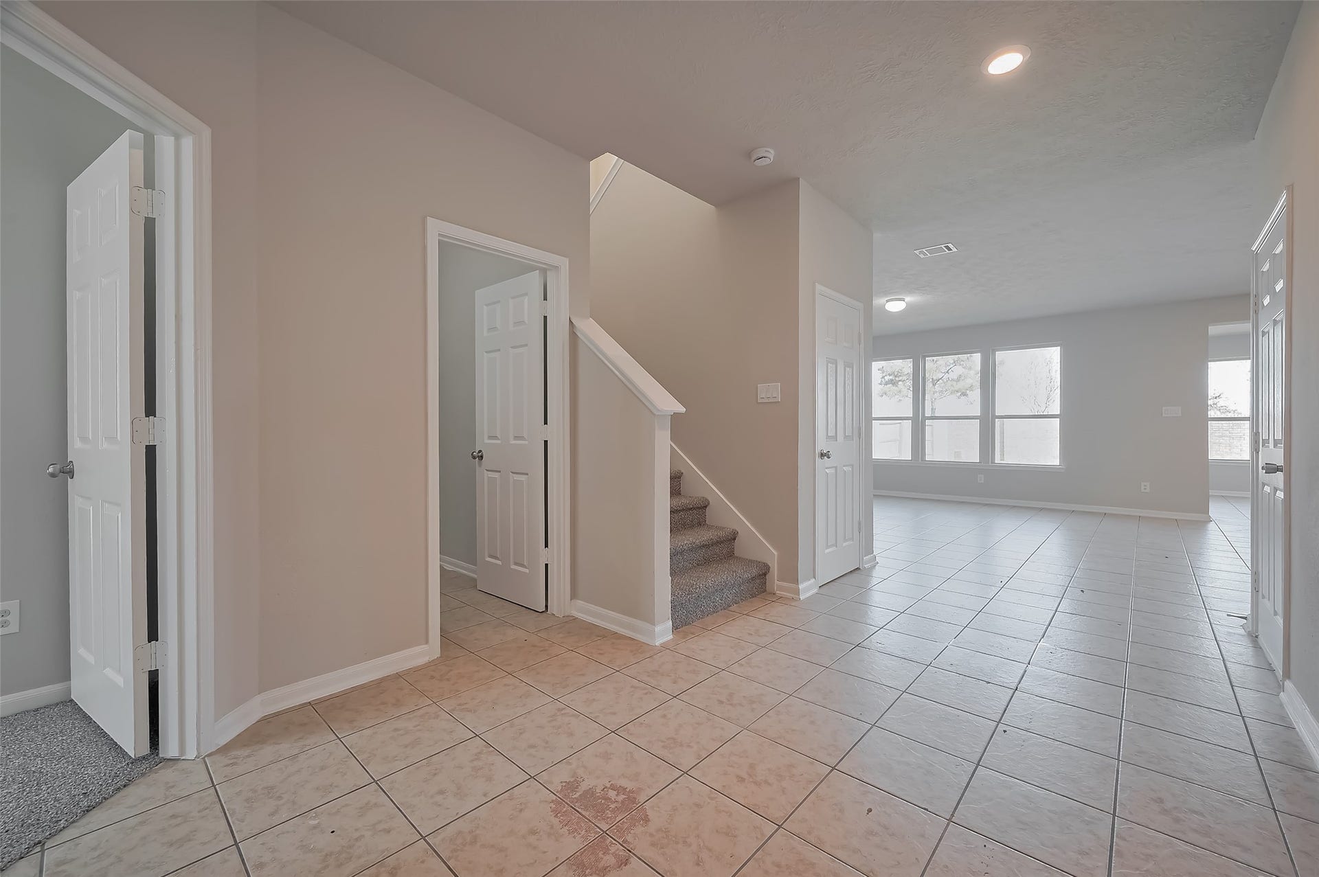 24114 Morrison Lane, Katy, TX 77493 Inviting entryway with tile flooring and carpeted stairs.
