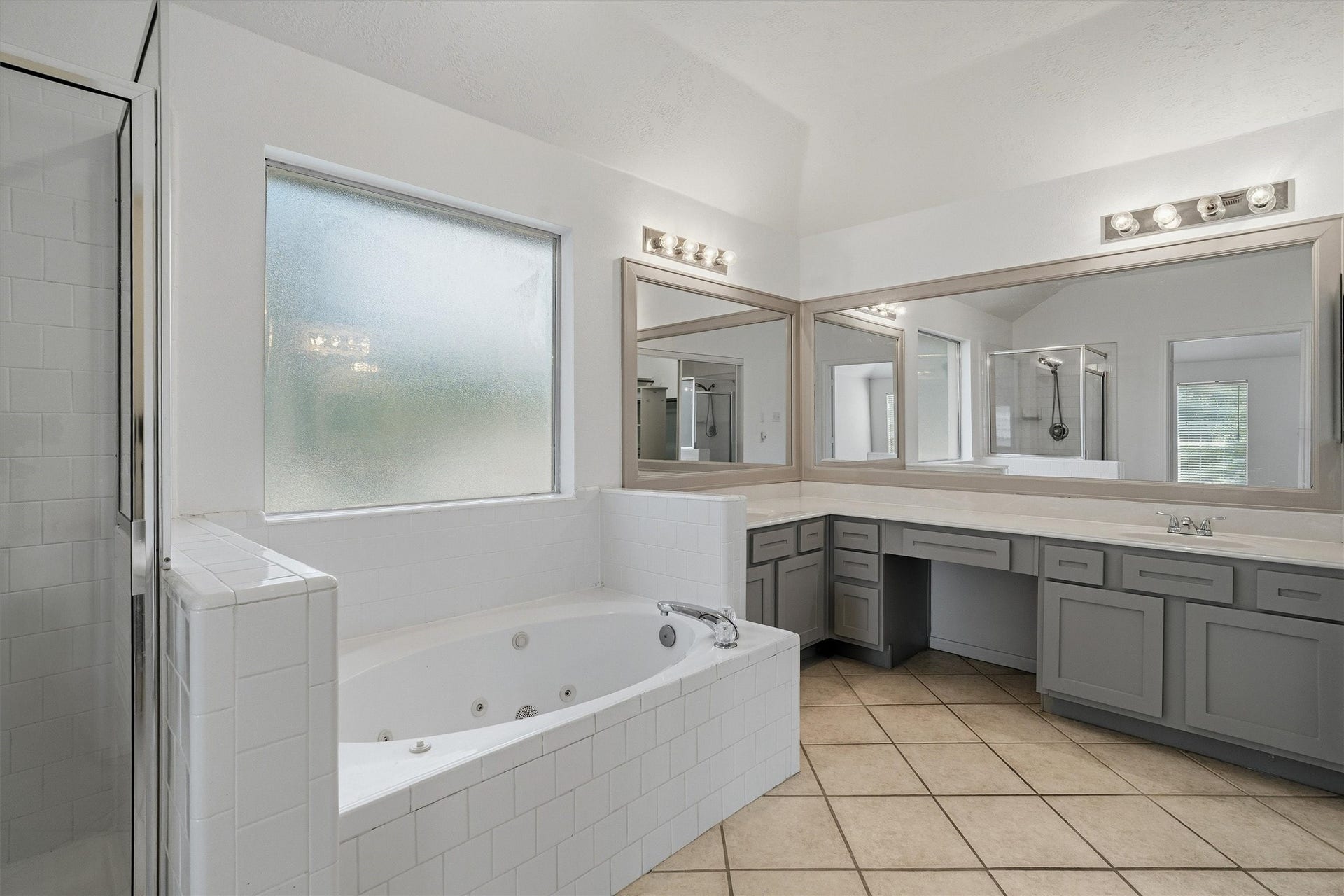 1107 Elmgrove Park Lane, Seabrook, TX 77586 Master bath offers separate jacuzzi tub, shower, his and her sinks