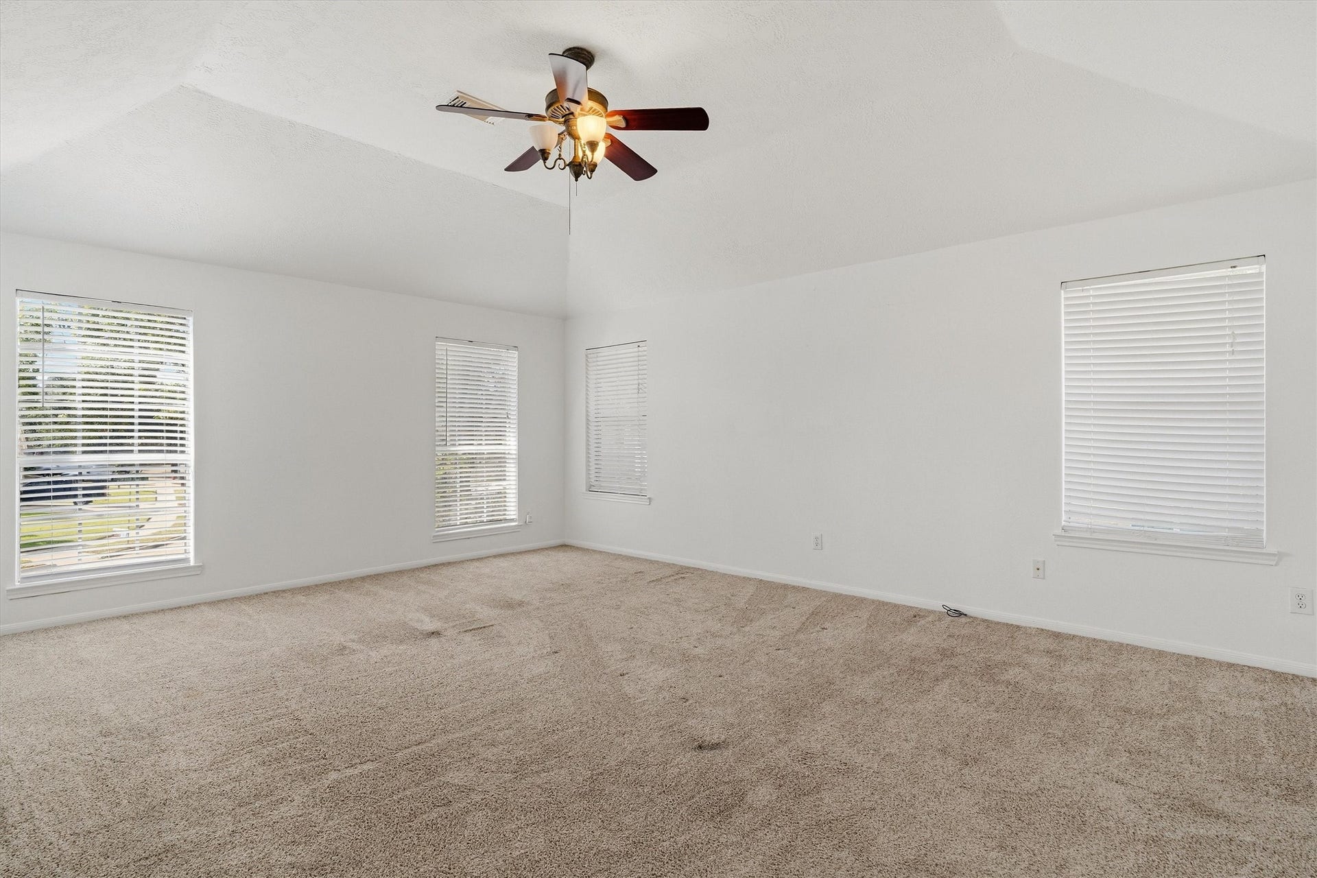 1107 Elmgrove Park Lane, Seabrook, TX 77586 Master bedroom with plenty of natural light and a ceiling fan