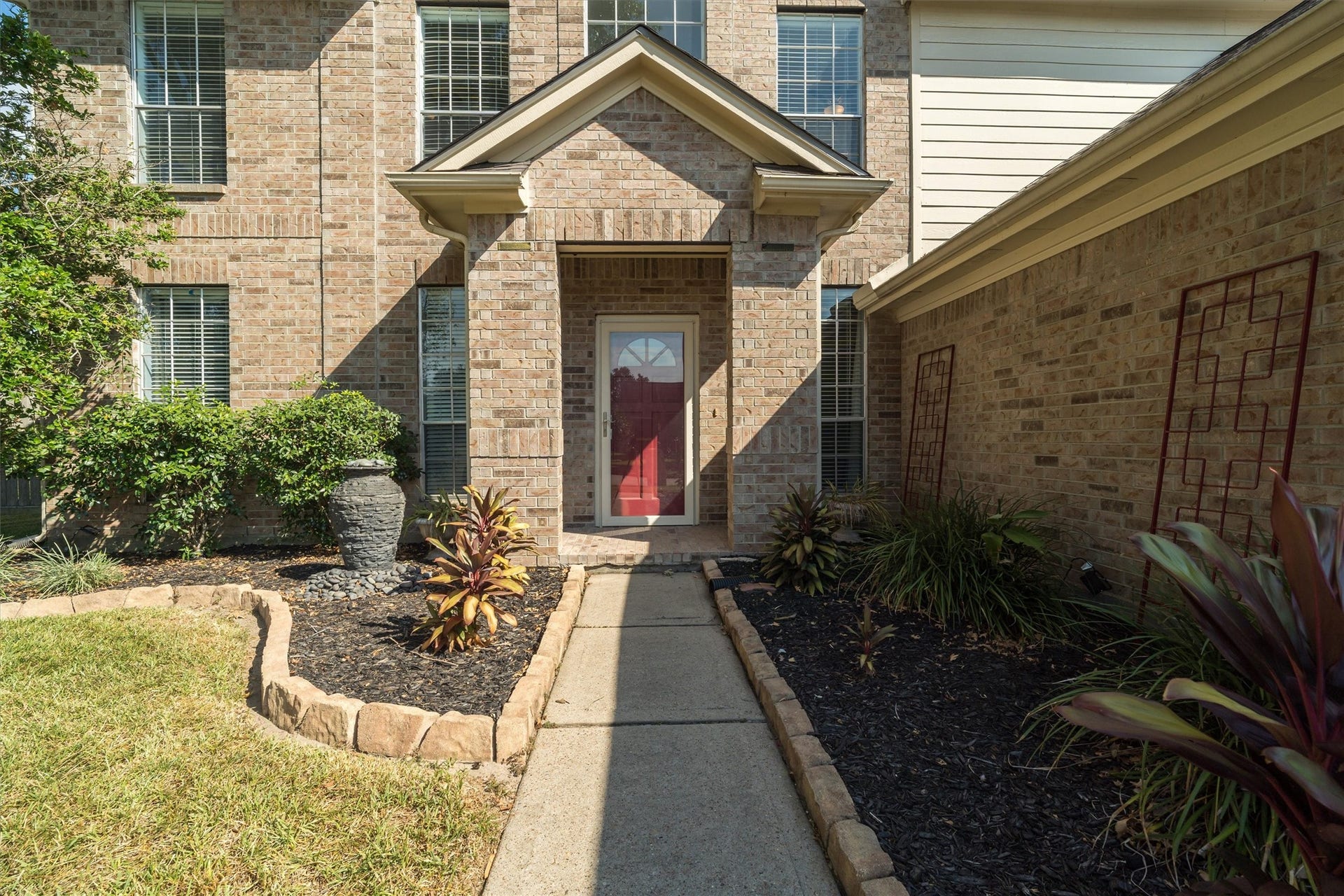 1107 Elmgrove Park Lane, Seabrook, TX 77586 Lovely landscaping and waterfall at the front entrance