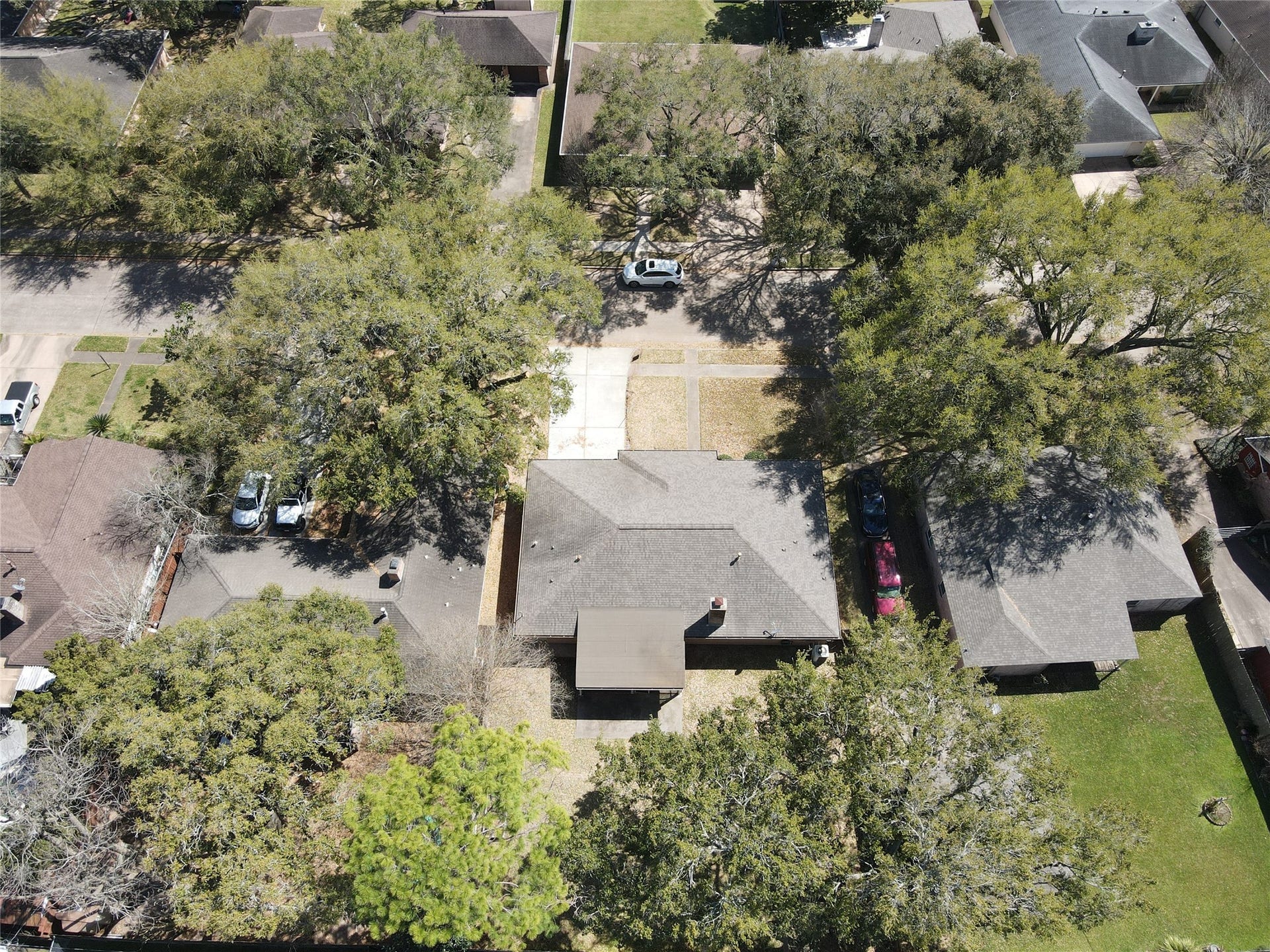124 Dogwood Street, Sugar Land, TX 77478 Nestled in a charming neighborhood, this home boasts a spacious backyard perfect for outdoor living, surrounded by mature trees offering privacy and tranquility.