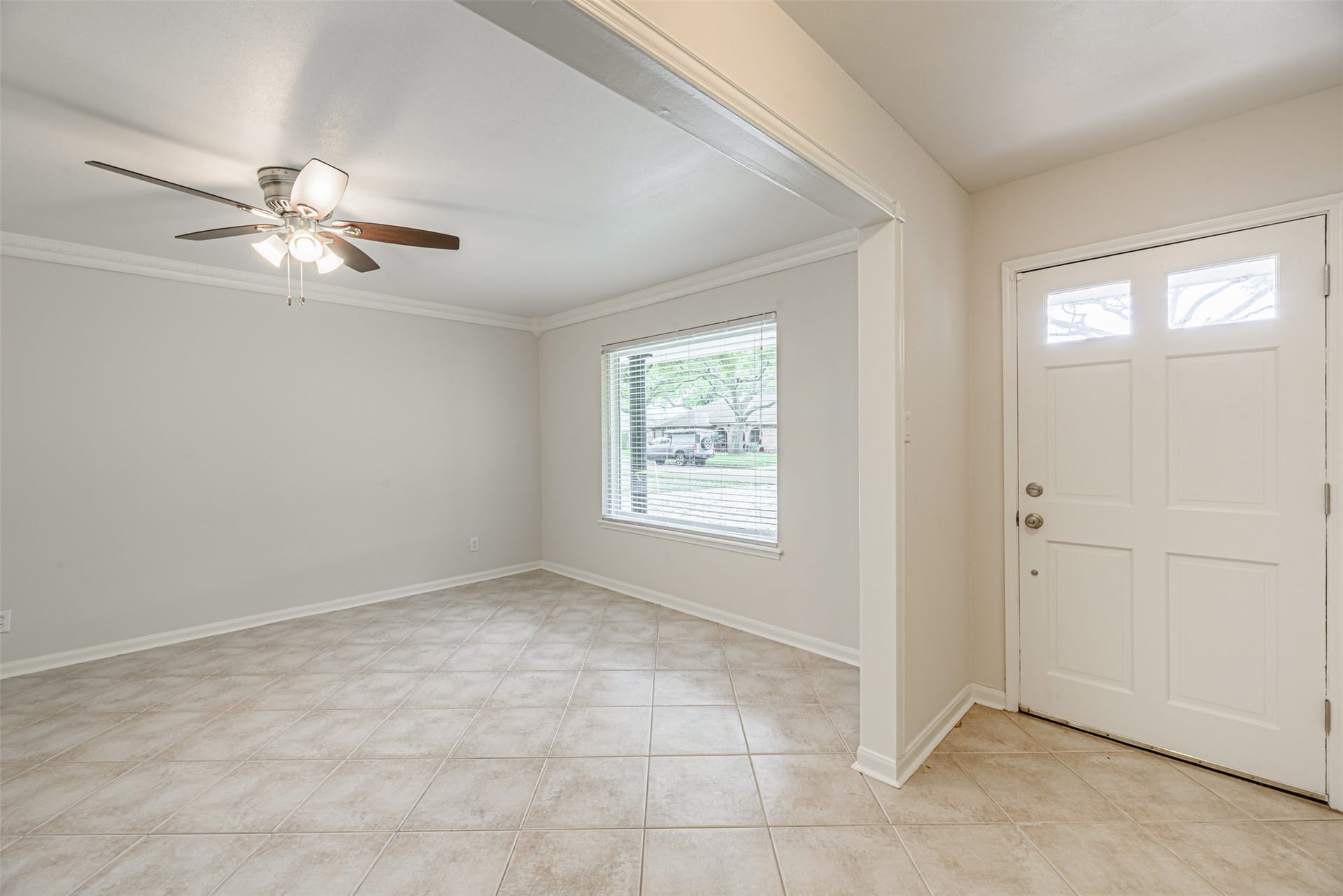124 Dogwood Street, Sugar Land, TX 77478 Formal living room. The window provides natural light and view of the street. On the right the main door that gives access to the house.