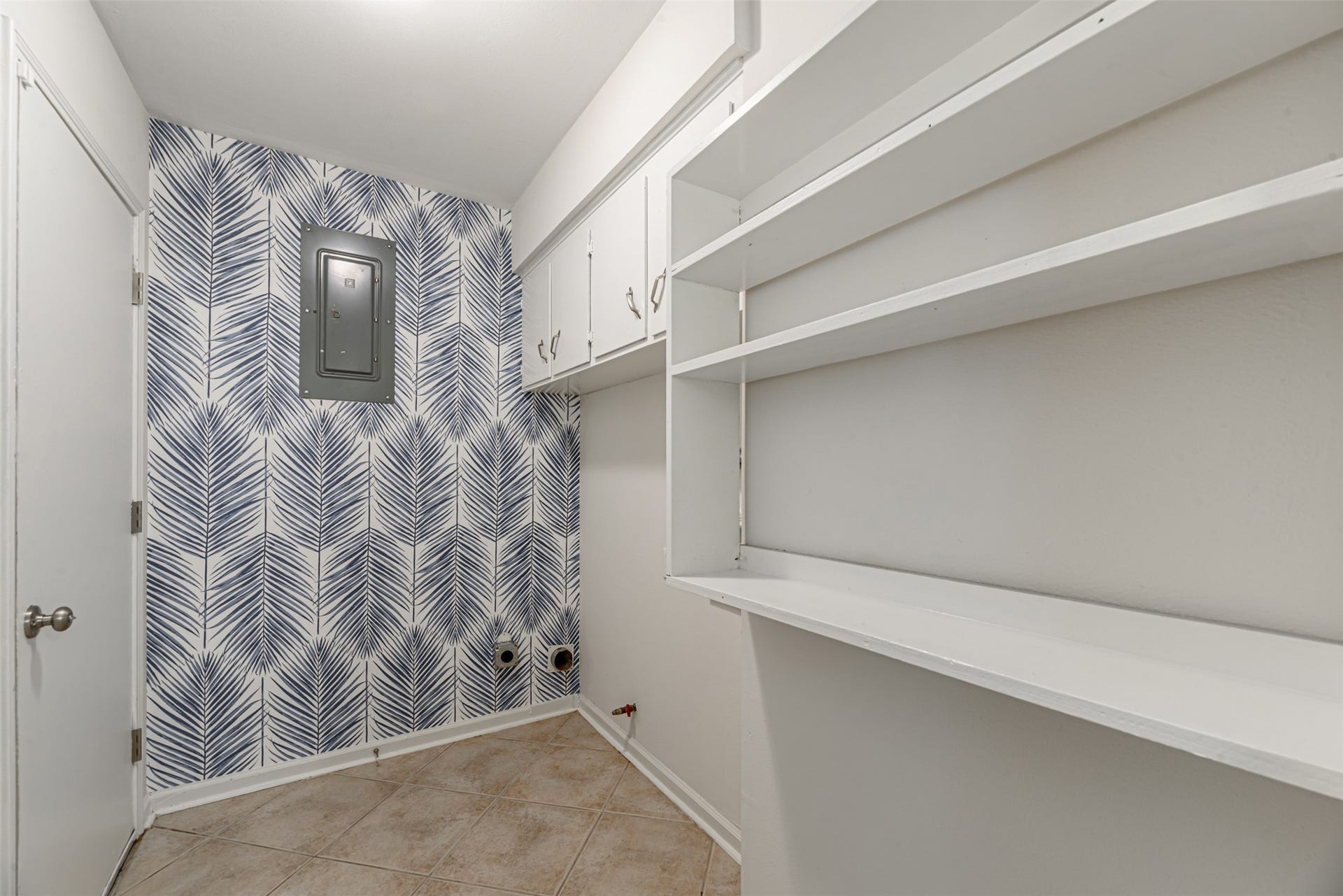 124 Dogwood Street, Sugar Land, TX 77478 In the laundry room are the main switches of the house. That door gives you access to the backyard.
