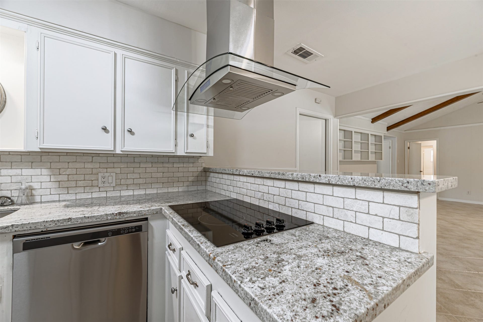 124 Dogwood Street, Sugar Land, TX 77478 Sleek stainless steel appliances and elegant granite countertops create a modern and inviting kitchen space.