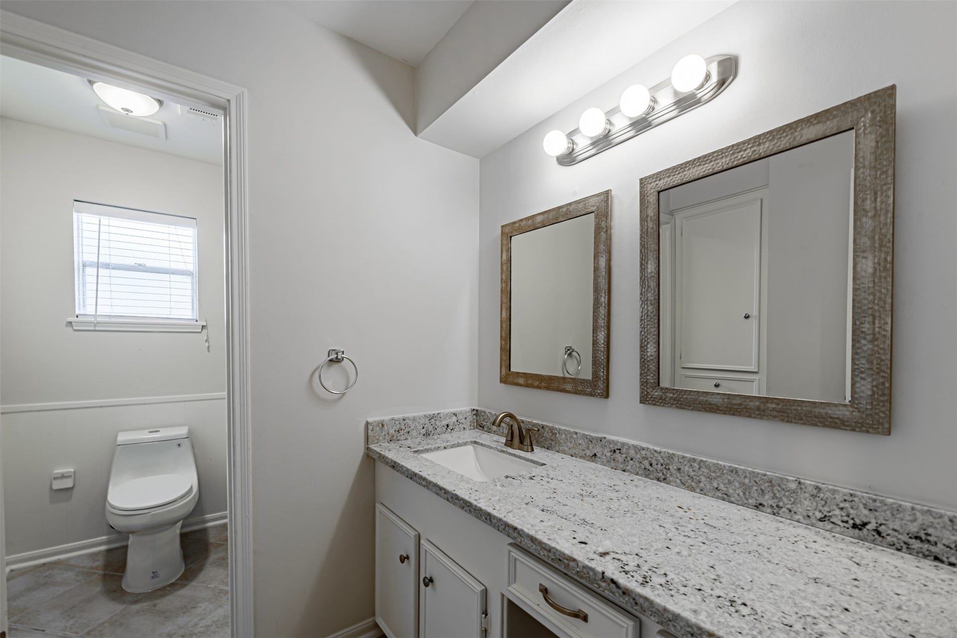 124 Dogwood Street, Sugar Land, TX 77478 Very modern and clean remodeled bathroom and plenty of work space on the vanities.