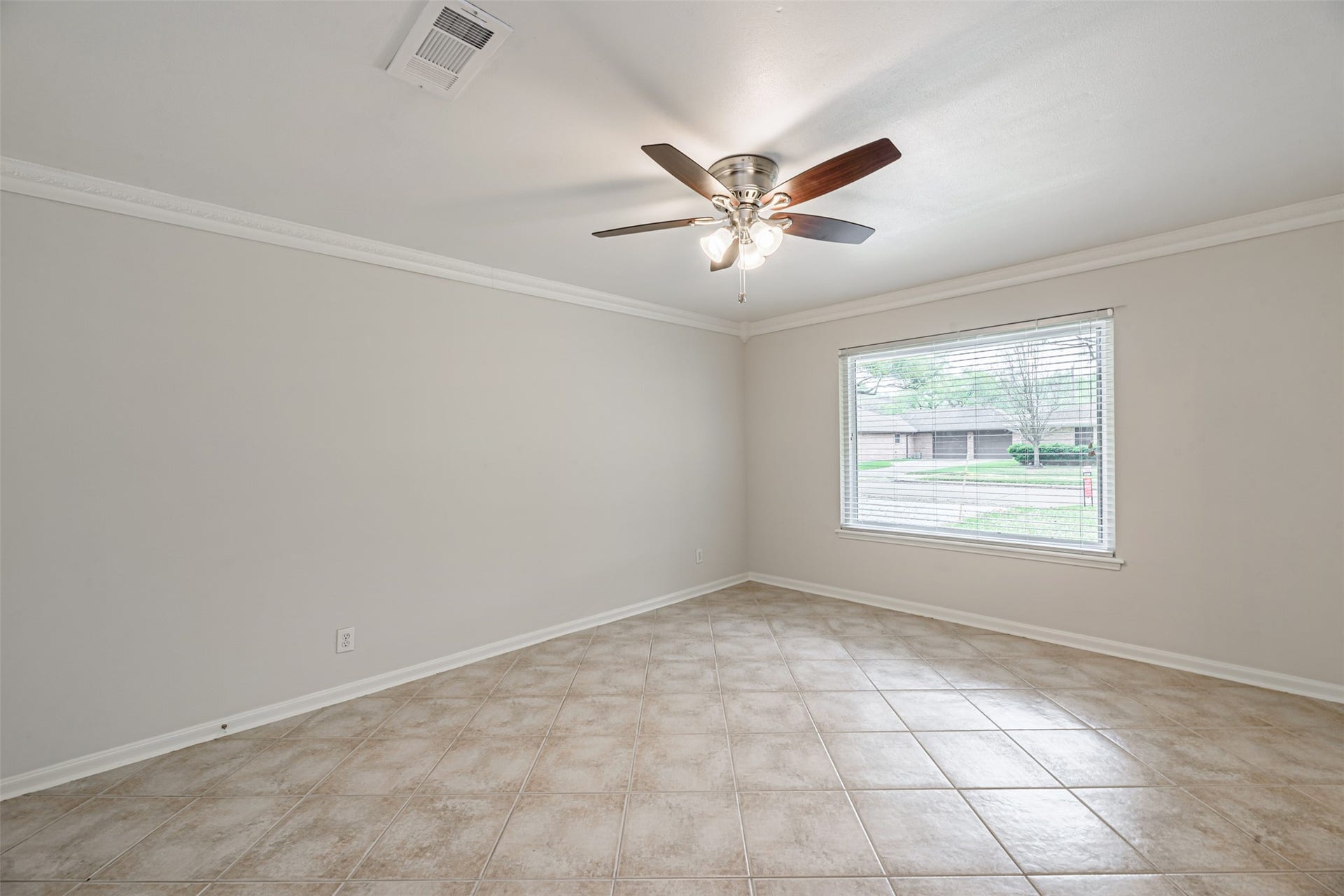124 Dogwood Street, Sugar Land, TX 77478 Abundant natural light floods this versatile space, perfect as a formal living area or easily transformed into a bright study.
