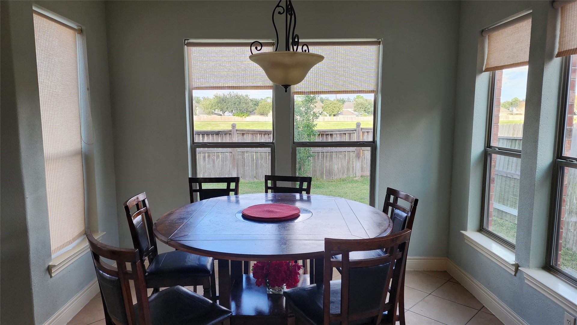 5442 Faircreek Ln Lane, Katy, TX 77450 Enjoy your morning coffee in this inviting breakfast area, bathed in natural light and offering serene backyard views.