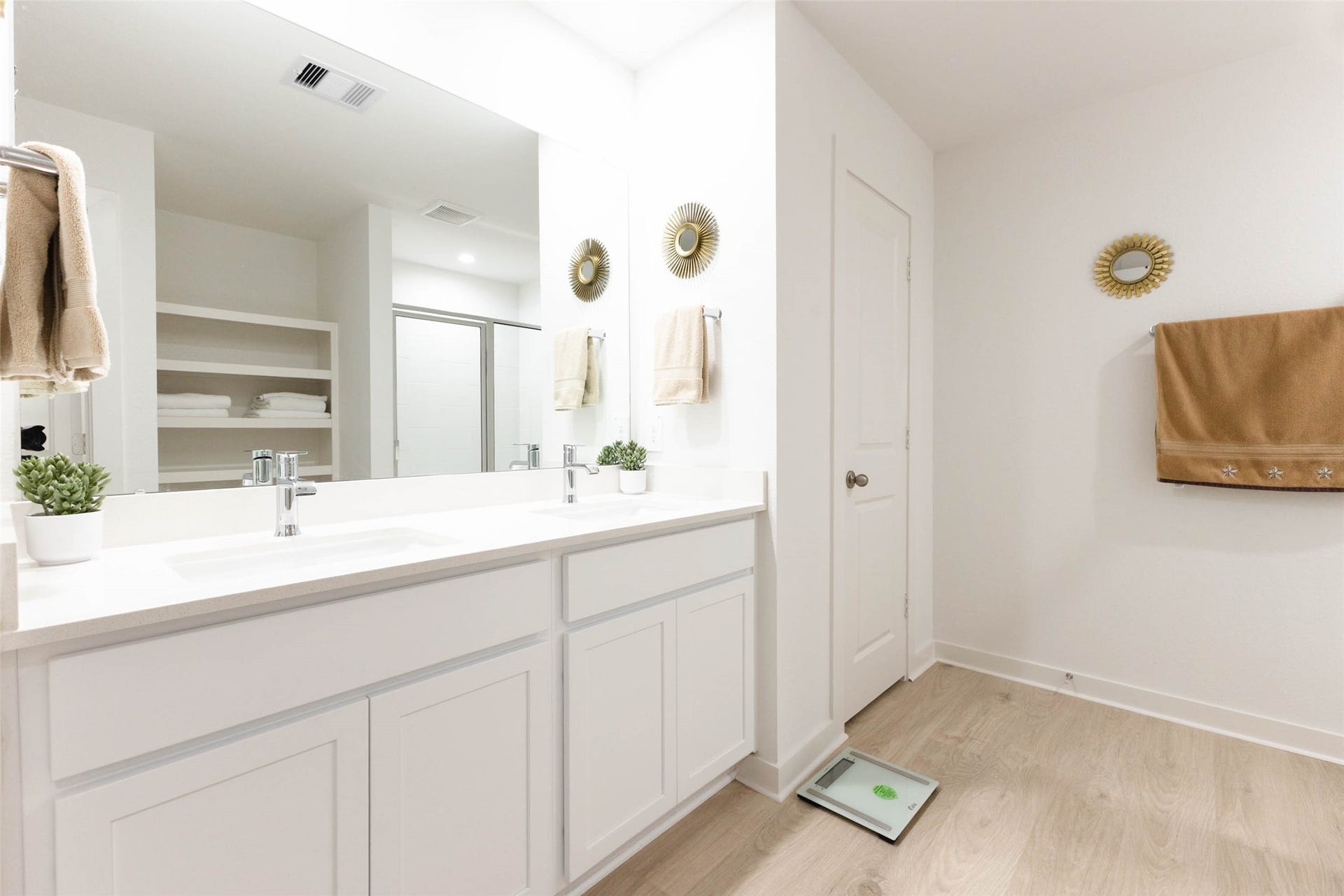 30502 White Cliff Court, Fulshear, TX 77441 Bright and modern bathroom featuring a double vanity with sleek fixtures, ample storage, and elegant decor.