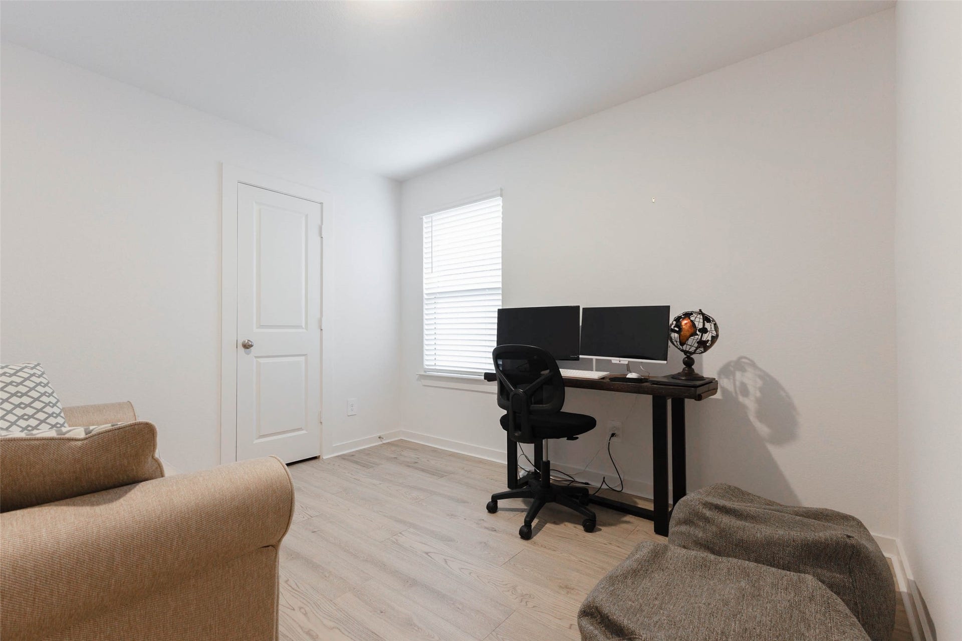 30502 White Cliff Court, Fulshear, TX 77441 Bright and versatile space, being used as home office.