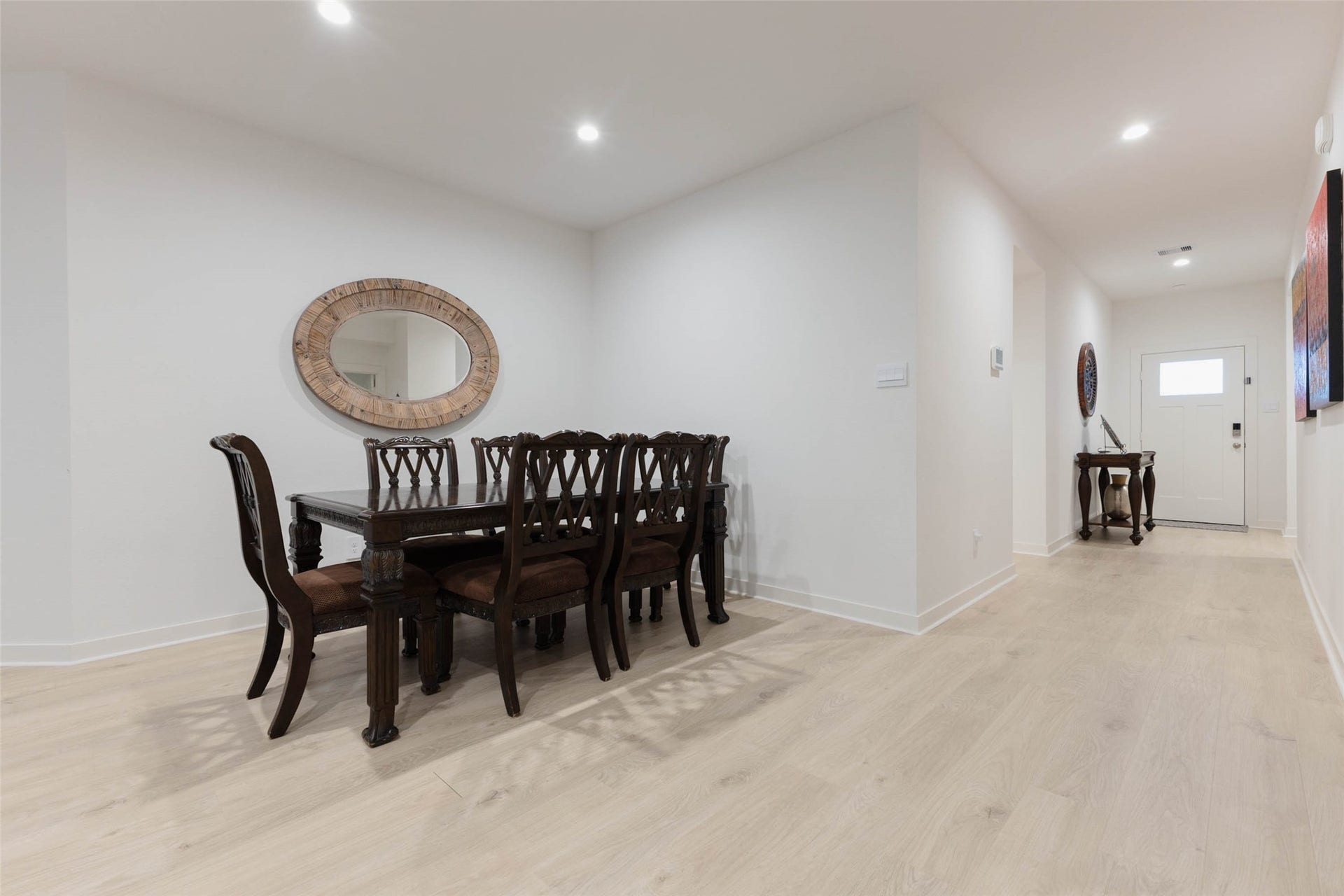 30502 White Cliff Court, Fulshear, TX 77441 Elegant dining area, complemented by light wood flooring.