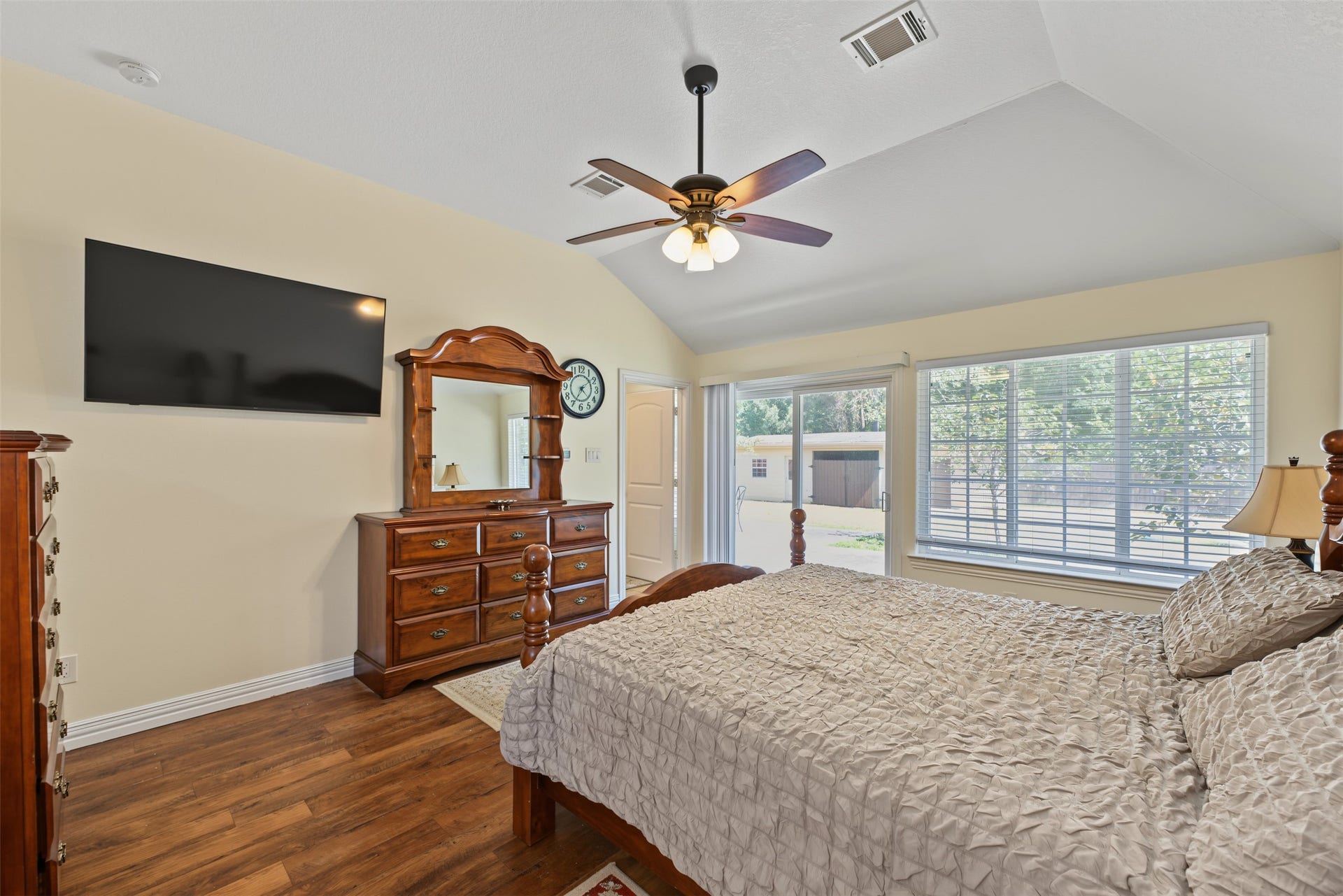 Primary bedroom with separate door to the backyard