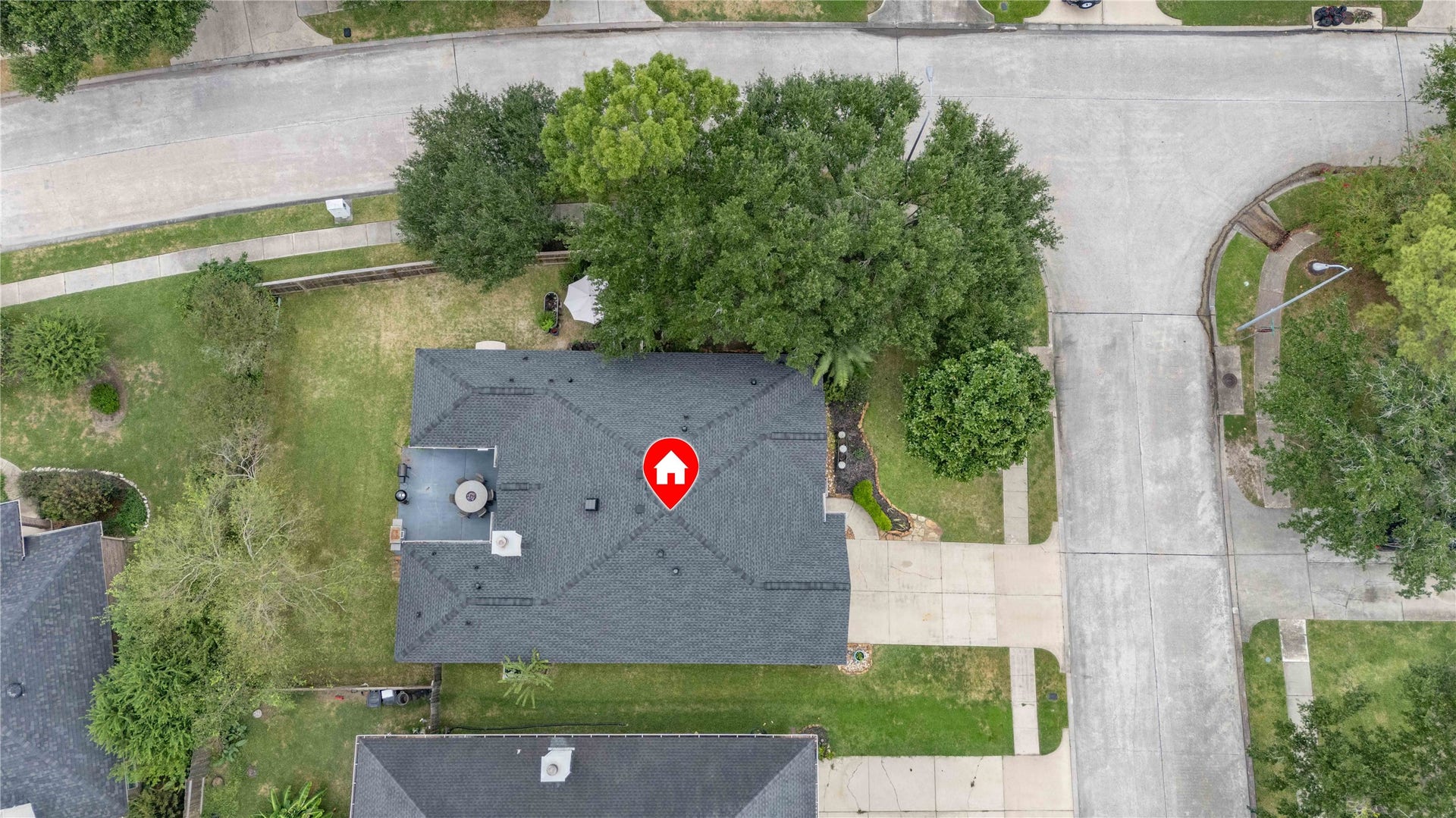 18343 Otter Creek Trail, Humble, TX 77346 Charming home nestled on a spacious corner lot, surrounded by lush greenery and offering ample yard space for outdoor activities.