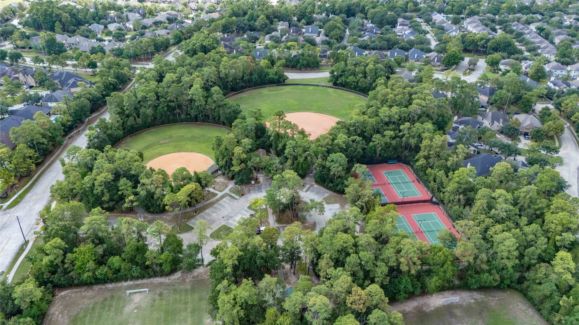 18343 Otter Creek Trail, Humble, TX 77346 Nestled amidst lush greenery, this vibrant community offers exceptional amenities including tennis courts and baseball fields, perfect for active lifestyles and family fun.