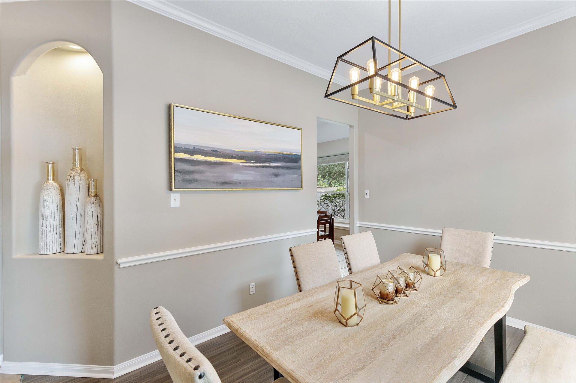 18343 Otter Creek Trail, Humble, TX 77346 Elegant dining room featuring a stylish chandelier and neutral tones, creating a welcoming atmosphere for gatherings.