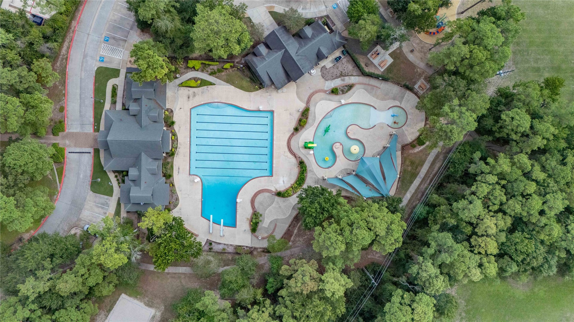 18343 Otter Creek Trail, Humble, TX 77346 Dive into a vibrant community lifestyle with access to a large pool, splash pad, and beautifully landscaped surroundings, perfect for relaxation and family fun.