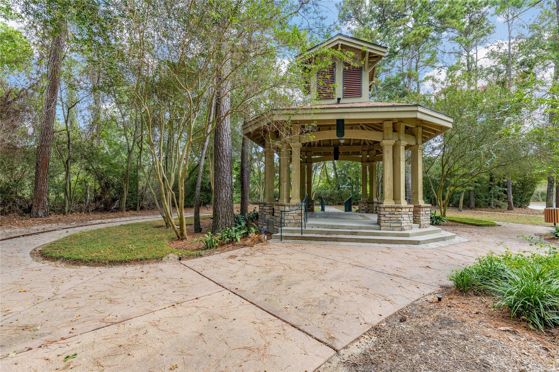 18343 Otter Creek Trail, Humble, TX 77346 Discover a serene community oasis featuring a charming pavilion surrounded by lush greenery, perfect for relaxation and outdoor gatherings.