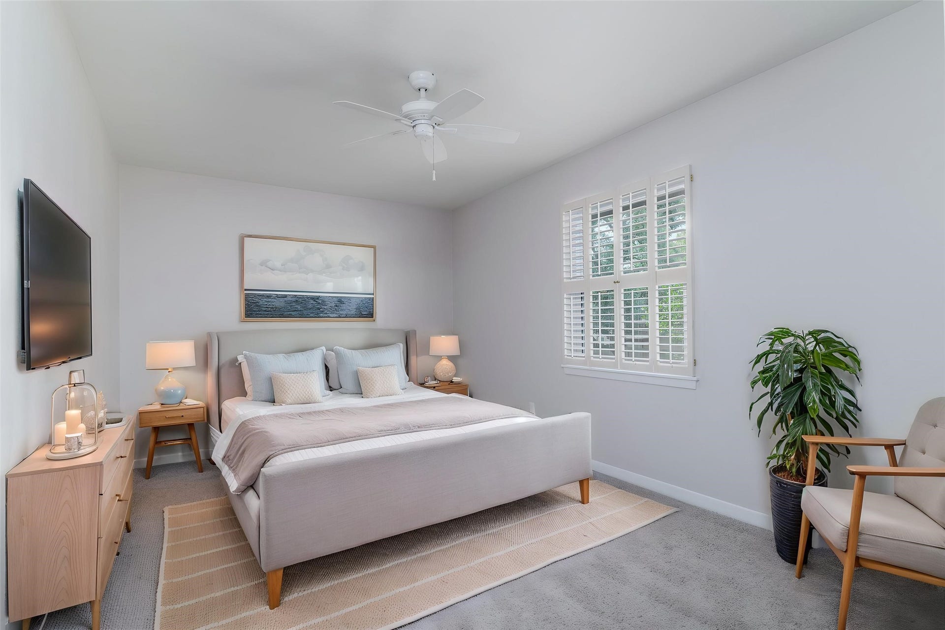 904 Winston Drive, Richmond, TX 77469 Secondary bedroom #2 upstairs with ceiling fan, plantation shutters and large closet. (this photo has been digitally staged to show the potential of the space)