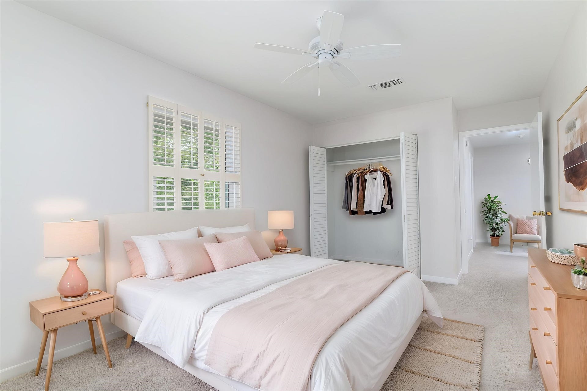 904 Winston Drive, Richmond, TX 77469 Secondary bedroom #1 upstairs with ceiling fan, plantation shutters and large closet. (this photo has been digitally staged to show the potential of the space)