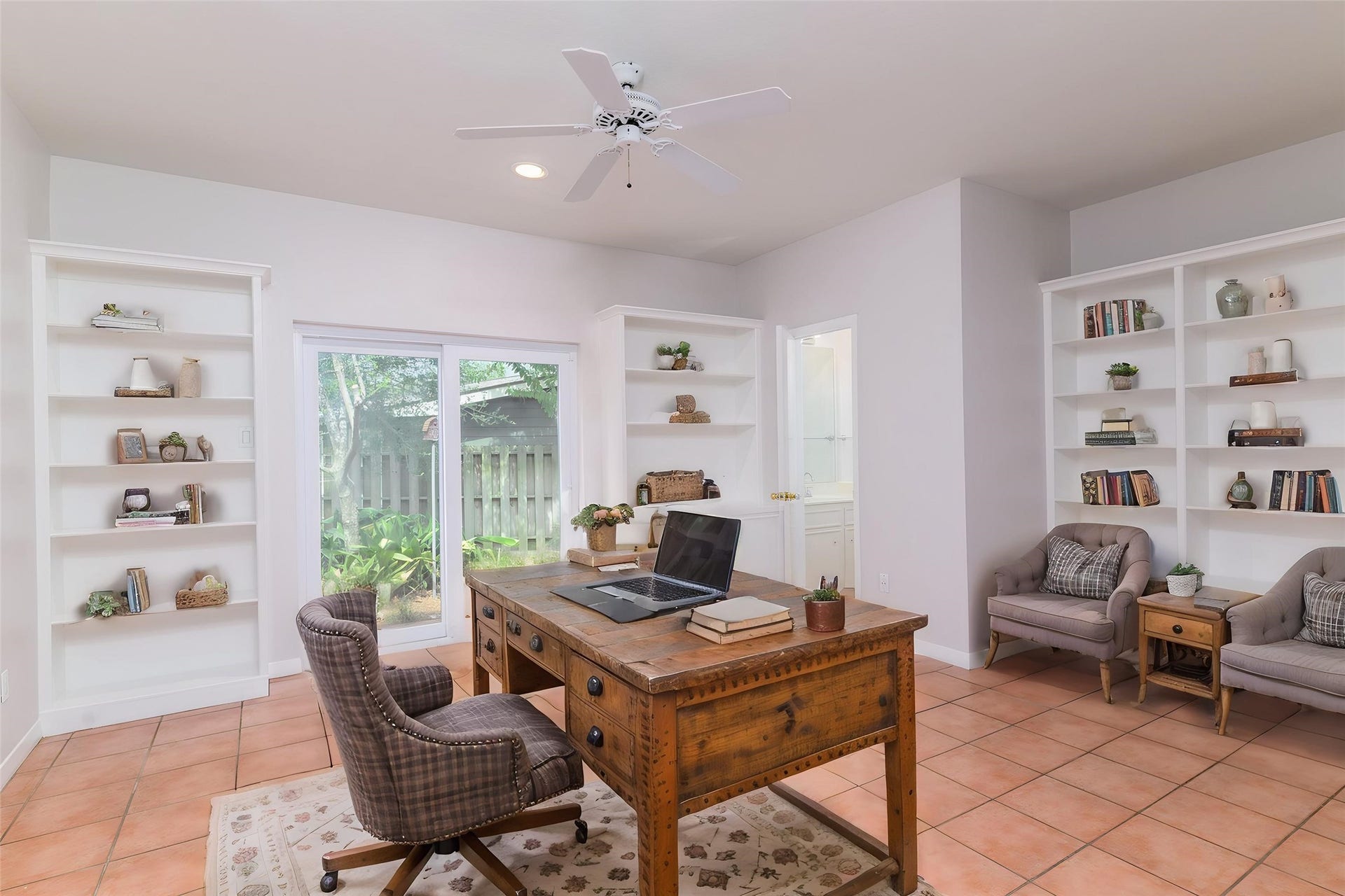 904 Winston Drive, Richmond, TX 77469 Once you finally make it inside the front door, you'll see the private study with convenient built-ins, its own half bath and a sliding glass door to a private brick patio. (this photo has been digitally staged to show the potential of the space)