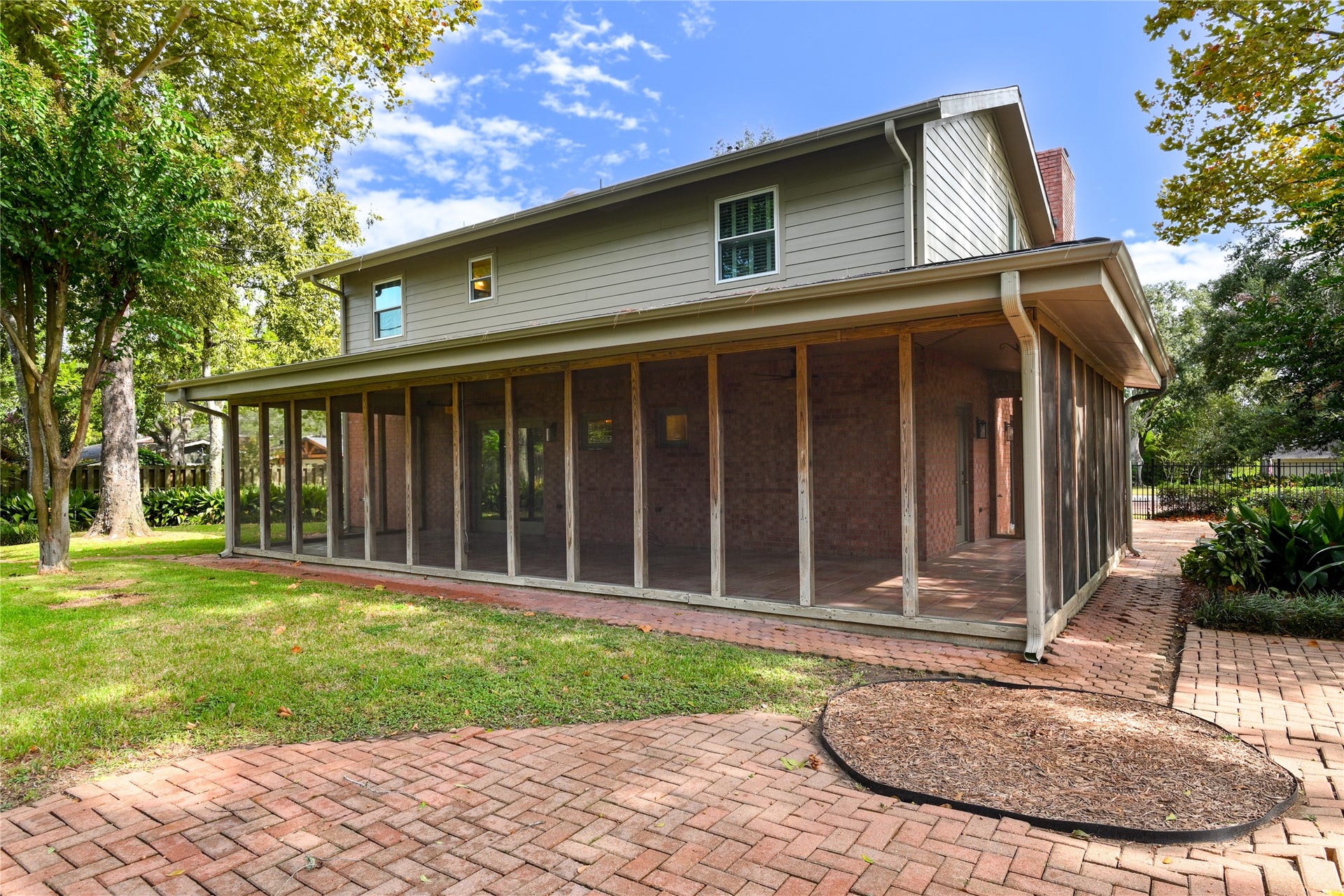 904 Winston Drive, Richmond, TX 77469 Behind the house there is plenty of green space, mature trees and lush landscaping.