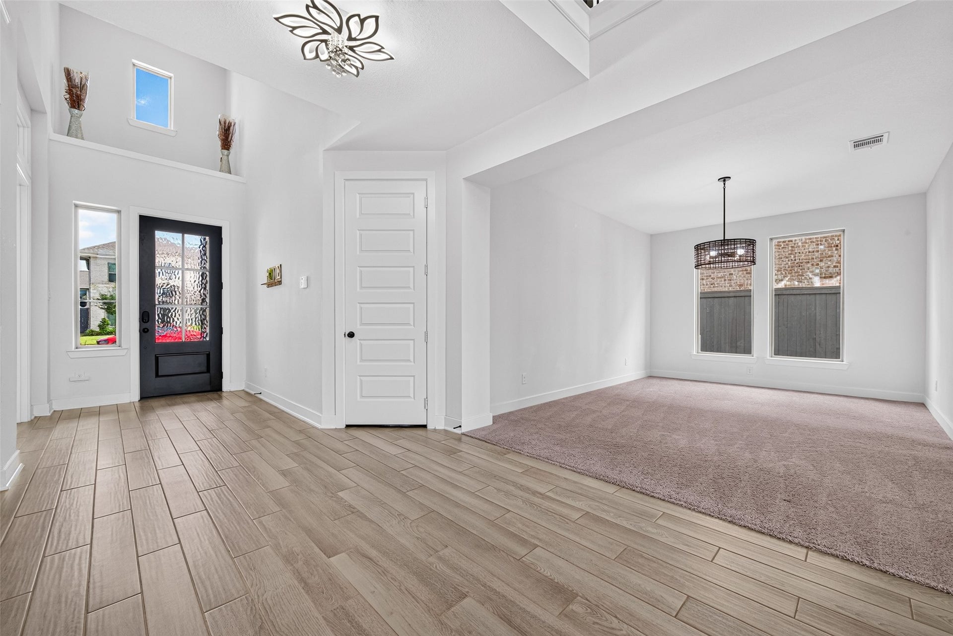 2511 Falling Fig Lane, Richmond, TX 77406 An elegant grand entry welcomes you with an abundance of natural light streaming through the front entrance, creating a striking first impression of luxury, warmth, and timeless sophistication