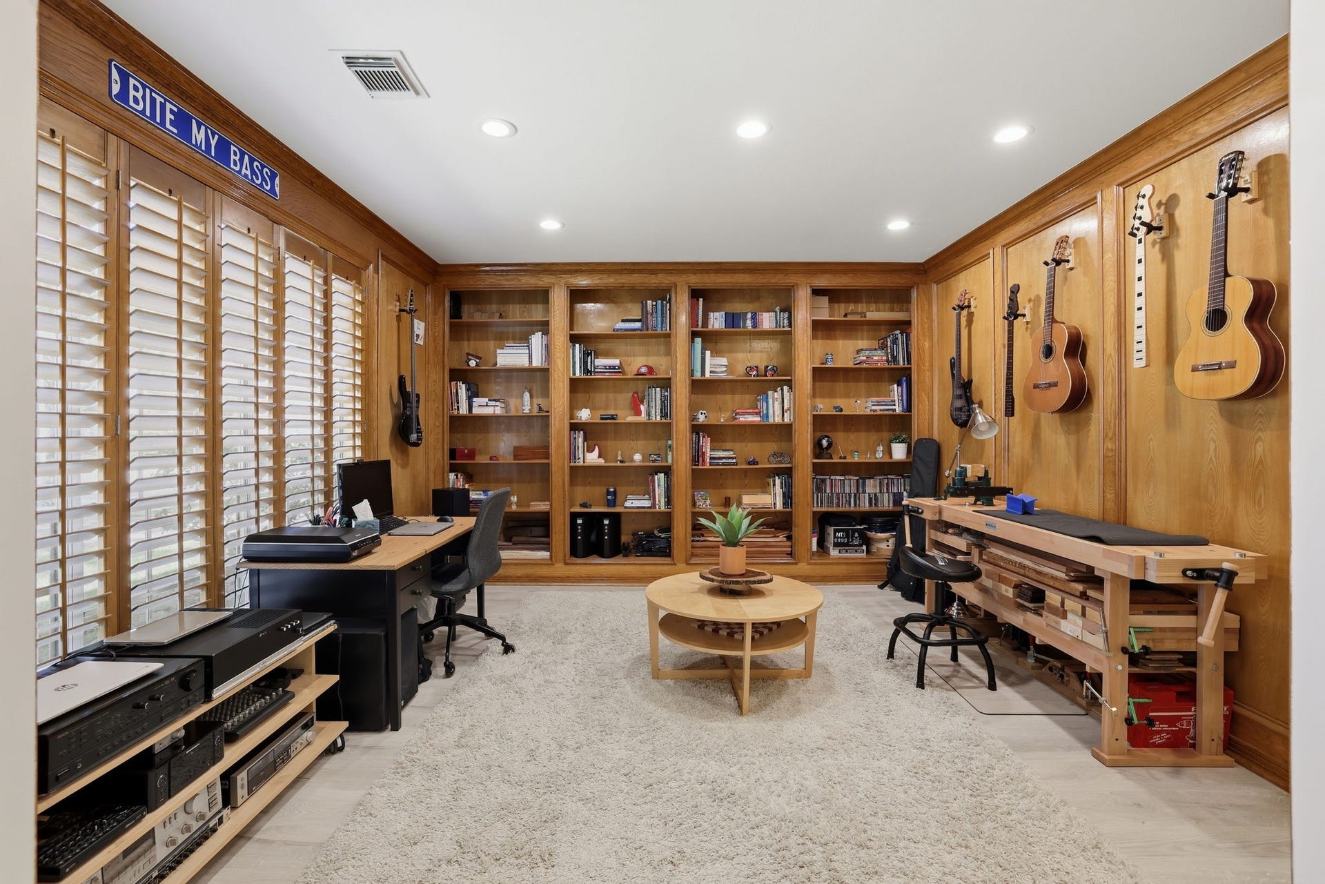 4519 Castlewood Street, Sugar Land, TX 77479 study, with beautiful wood paneling, built in shelves and cabinets, also with plenty of windows and natural light!