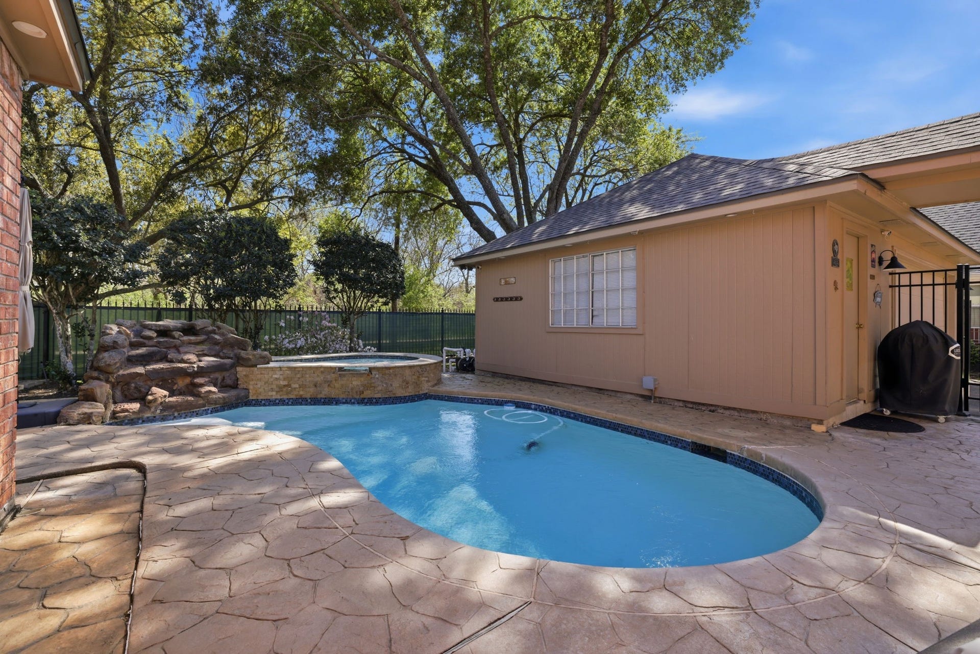 4519 Castlewood Street, Sugar Land, TX 77479 Great pool and a view of the oversized garage