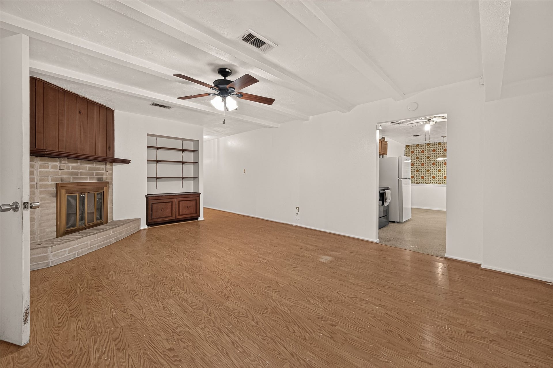 7742 Willow Mint Lane, Houston, TX 77086 Open living area with fireplace