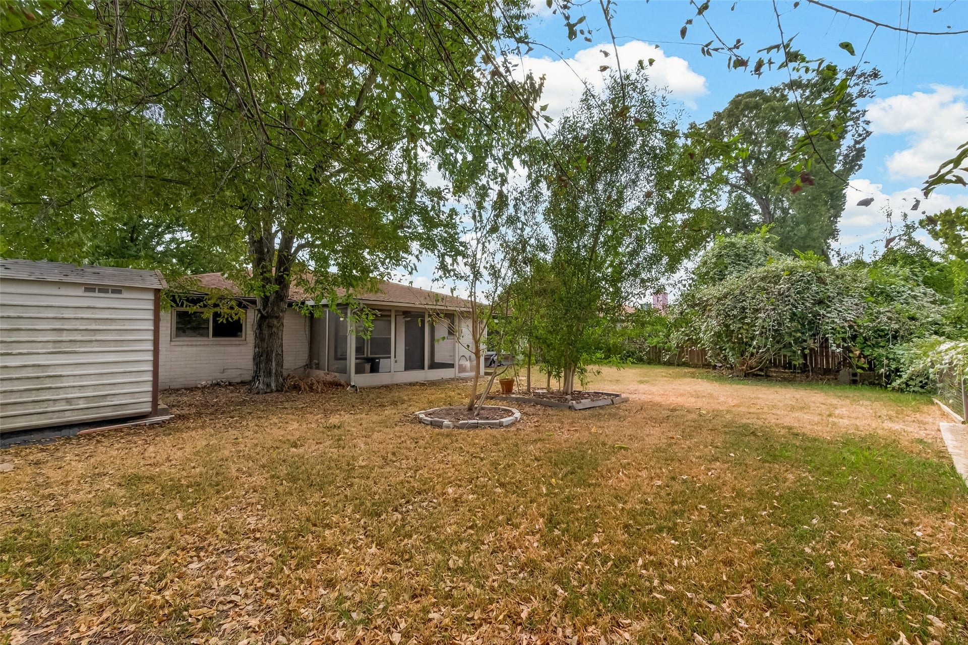 7742 Willow Mint Lane, Houston, TX 77086 Spacious backyard and shed stays.