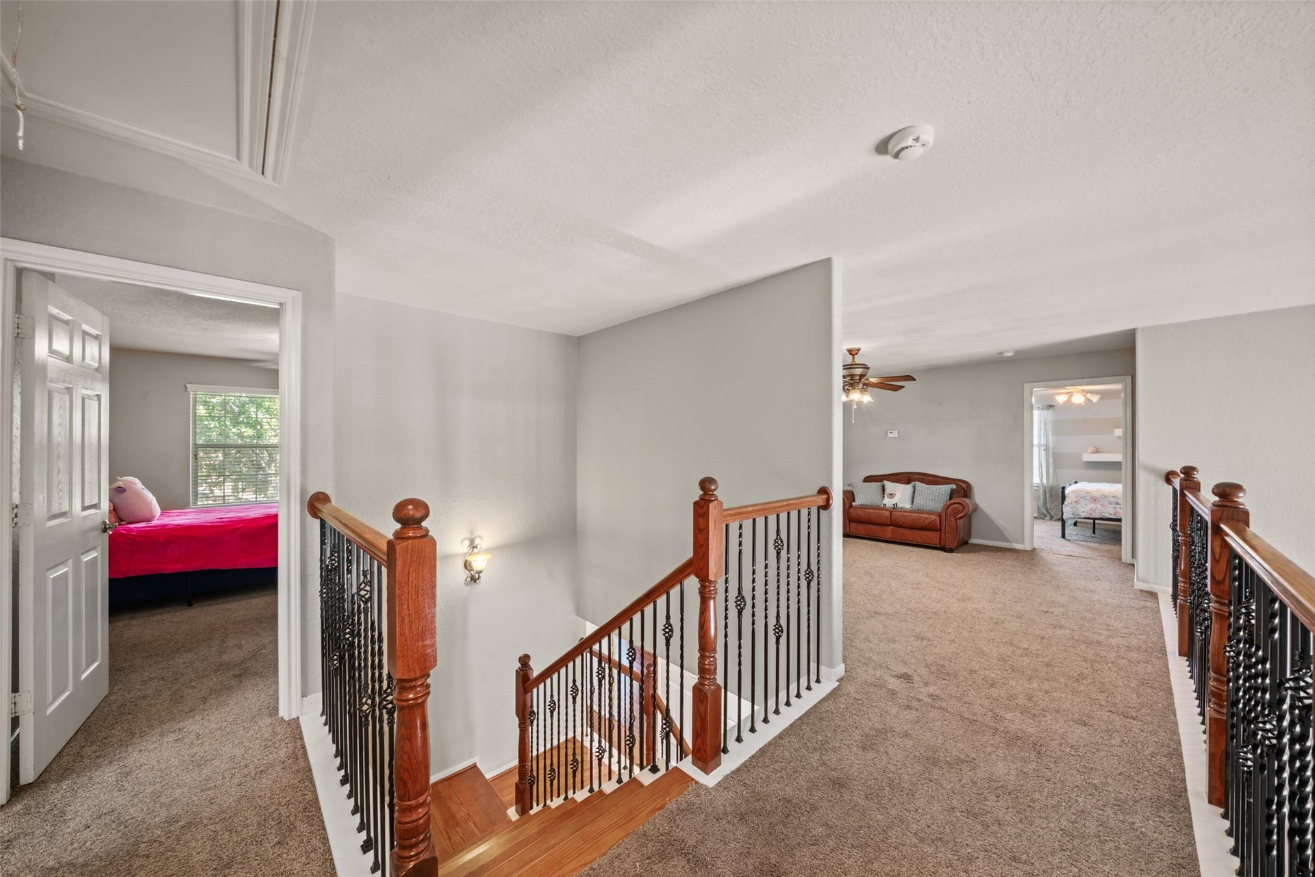 The upstairs landing connecting the second floor rooms.