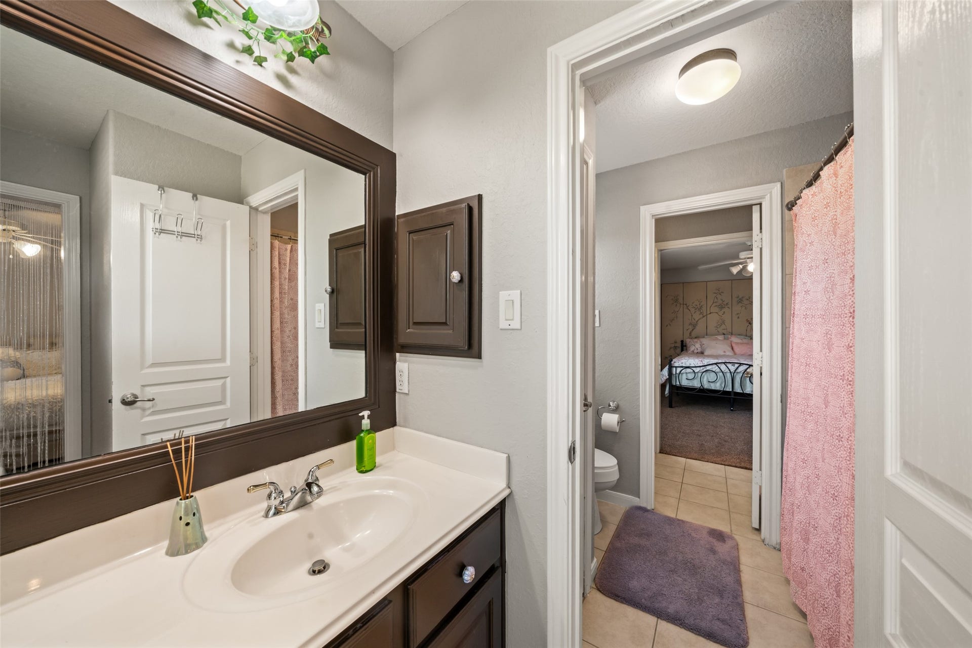 This upstairs shared bathroom has a vanity by each bedroom making getting ready routines easier.