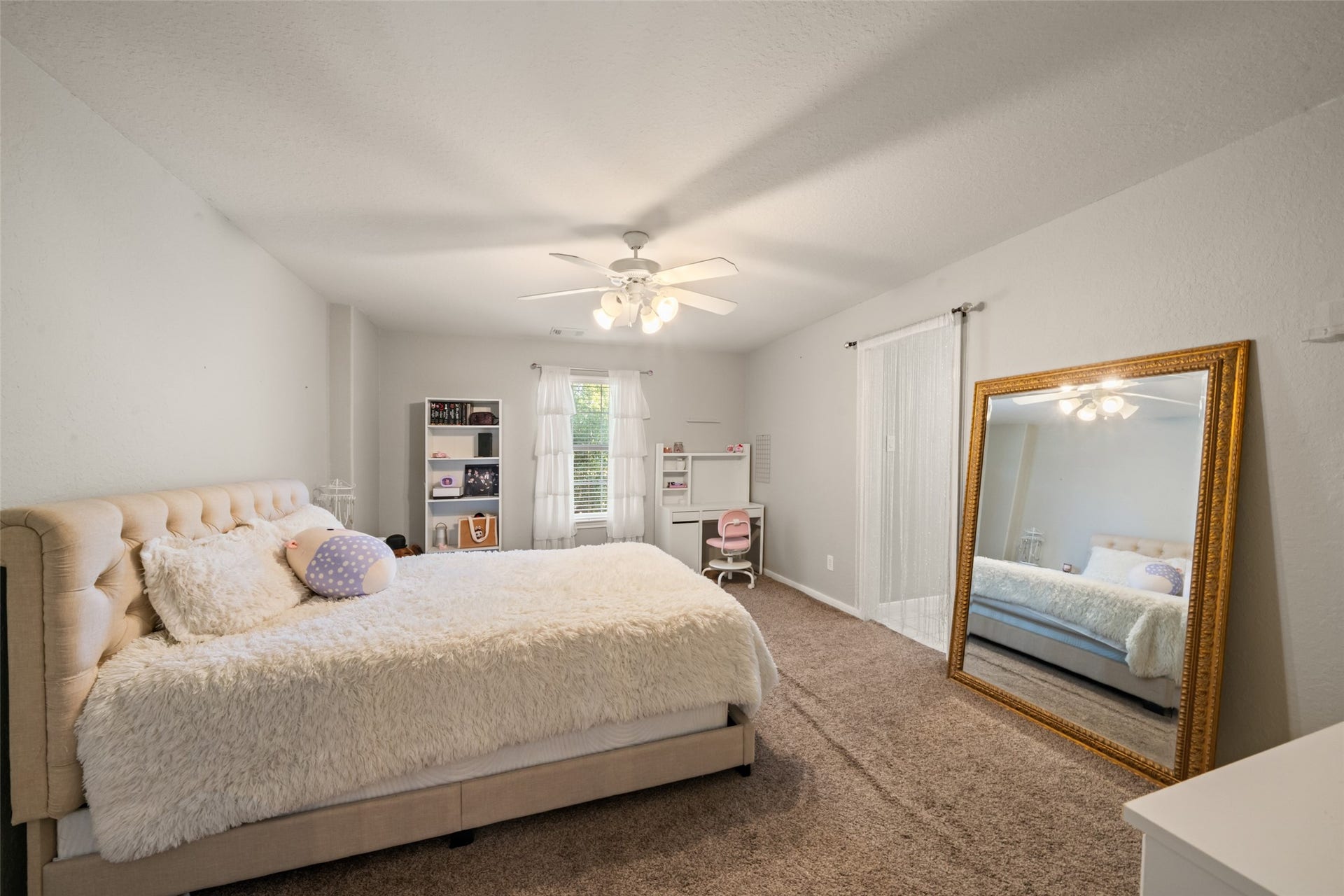 Still another large bedroom filled with natural light.