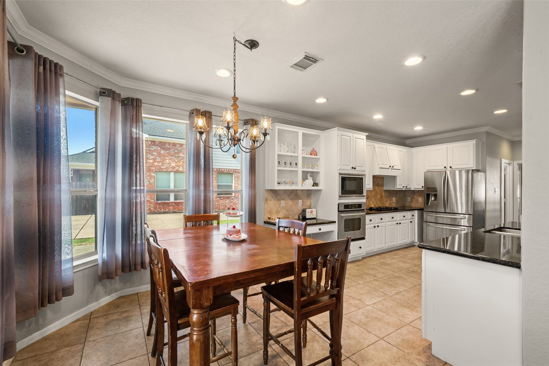 The breakfast area and kitchen flow together beautifully.
