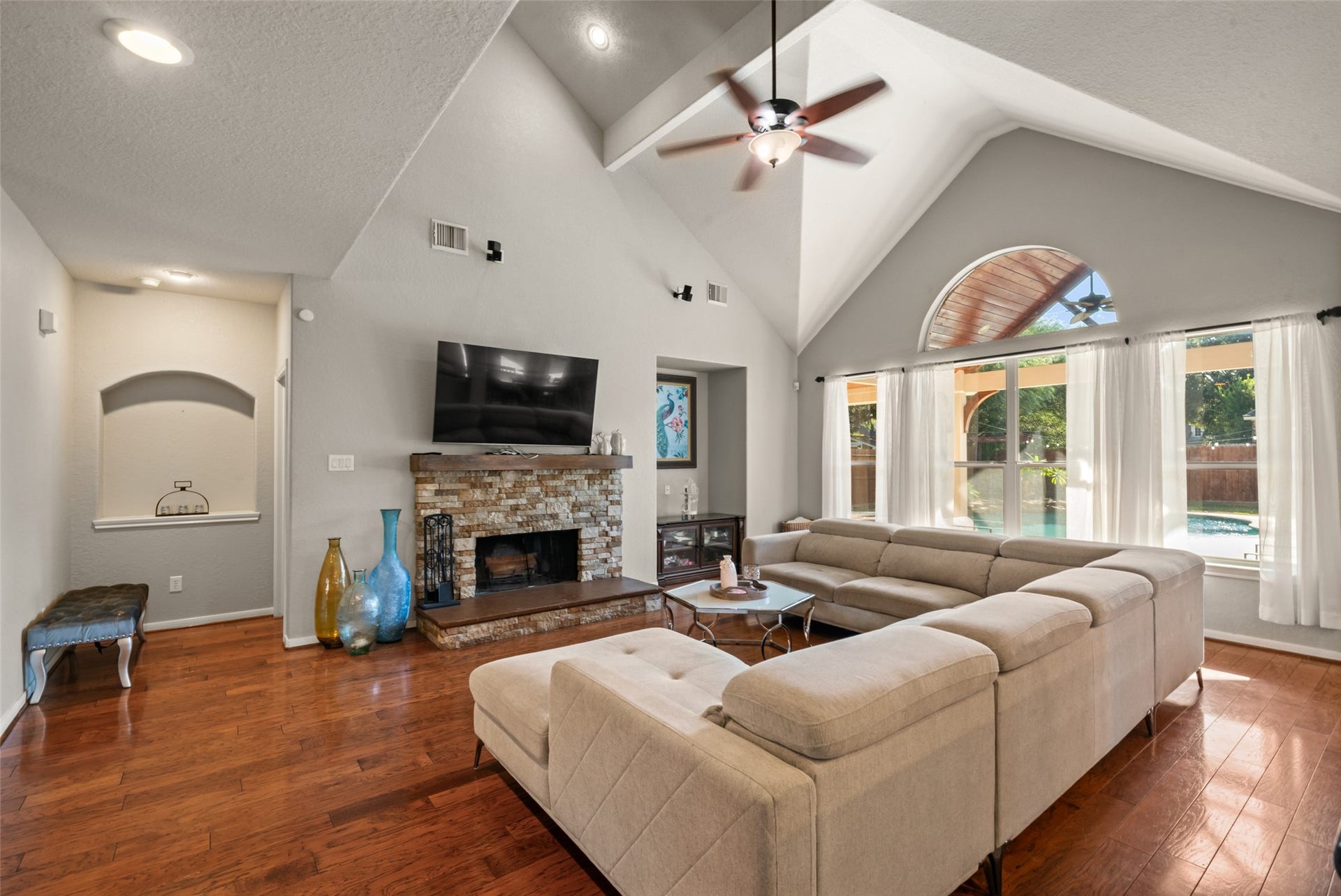 Gather around the fireplace beneath the beautiful soaring ceilings.