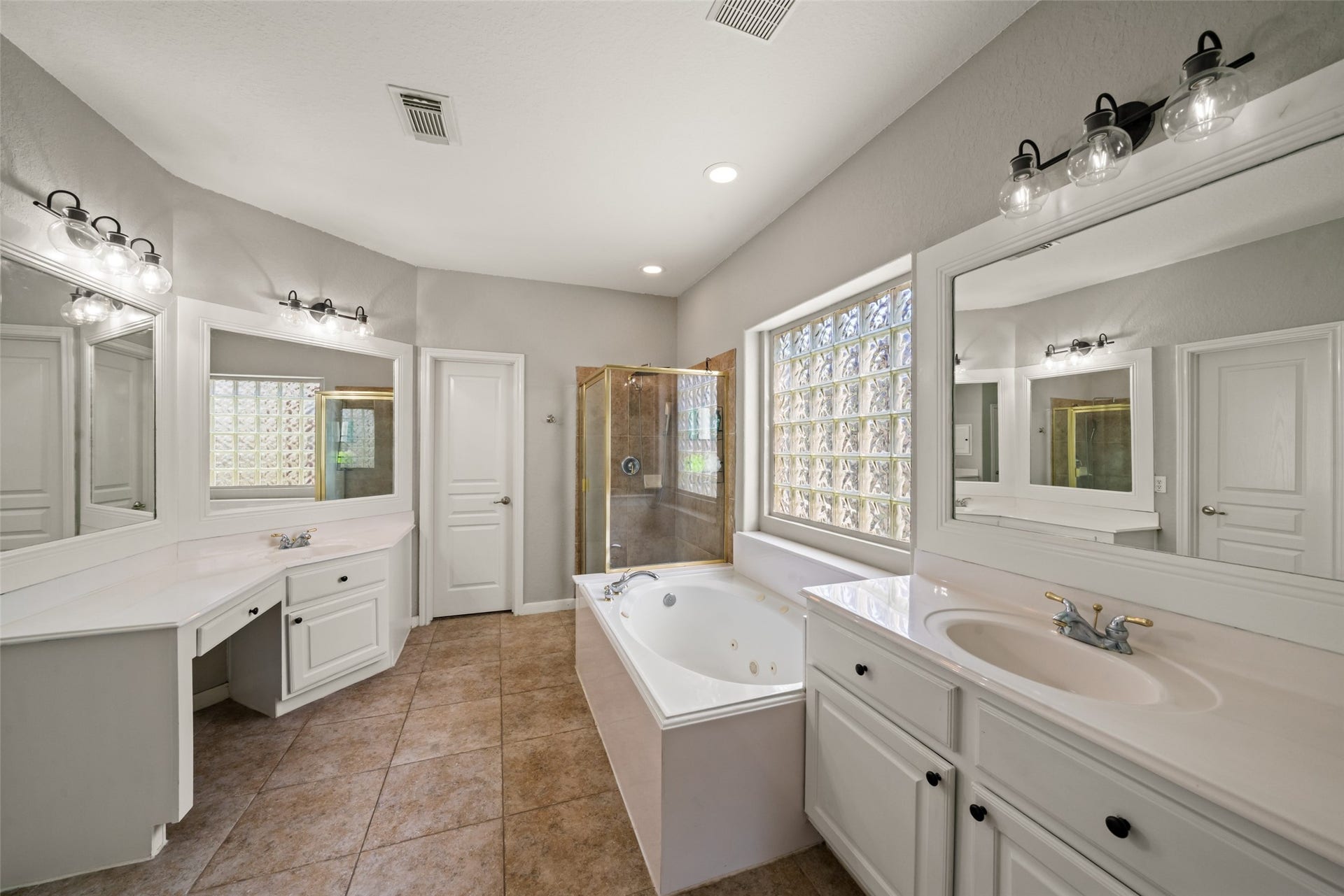 Double vanities bring convenience to the primary bathroom.