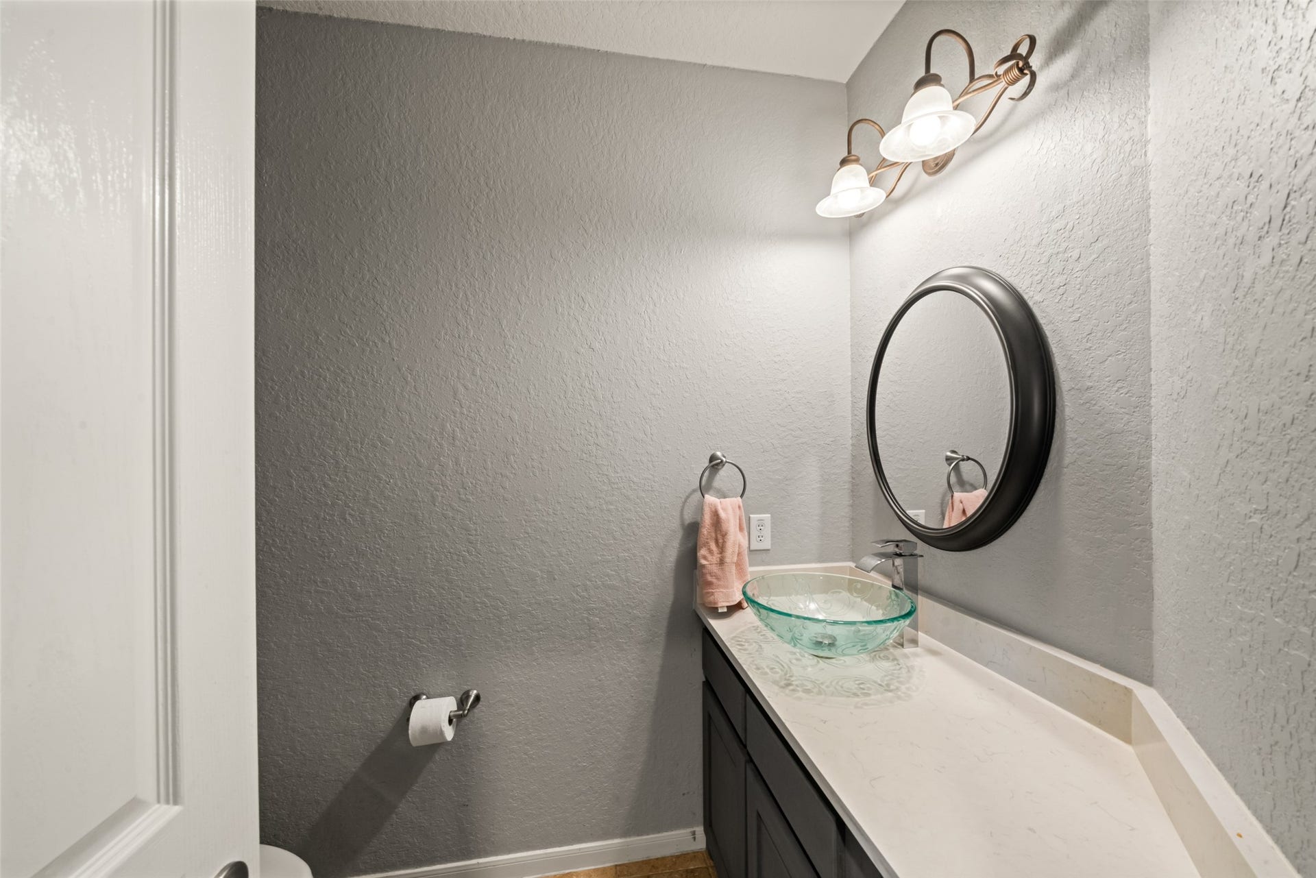 A convenient half bath downstairs for guests.