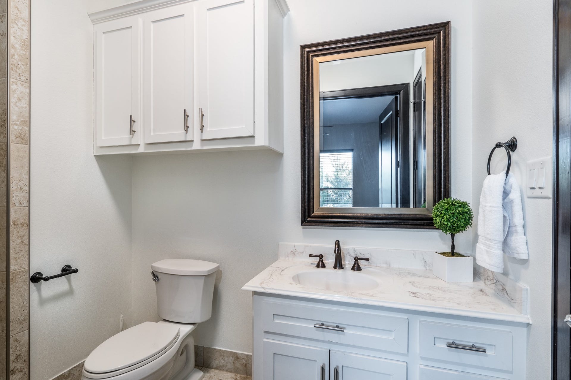 Equipped with extra wide doors including to the patio area and a roll-in shower.