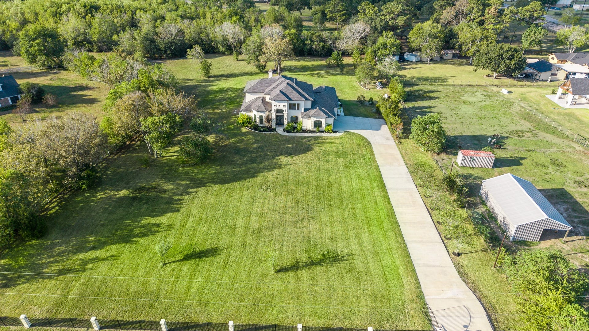Your gated private drive leads to your property where horses and other animals are allowed.