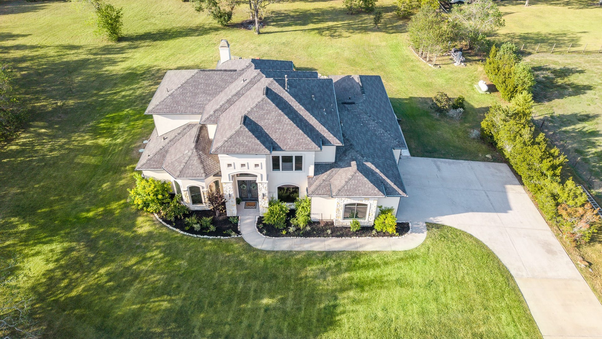 Extra-wide driveway with a 2.5 car garage perfect for your golf cart or side-by-side.