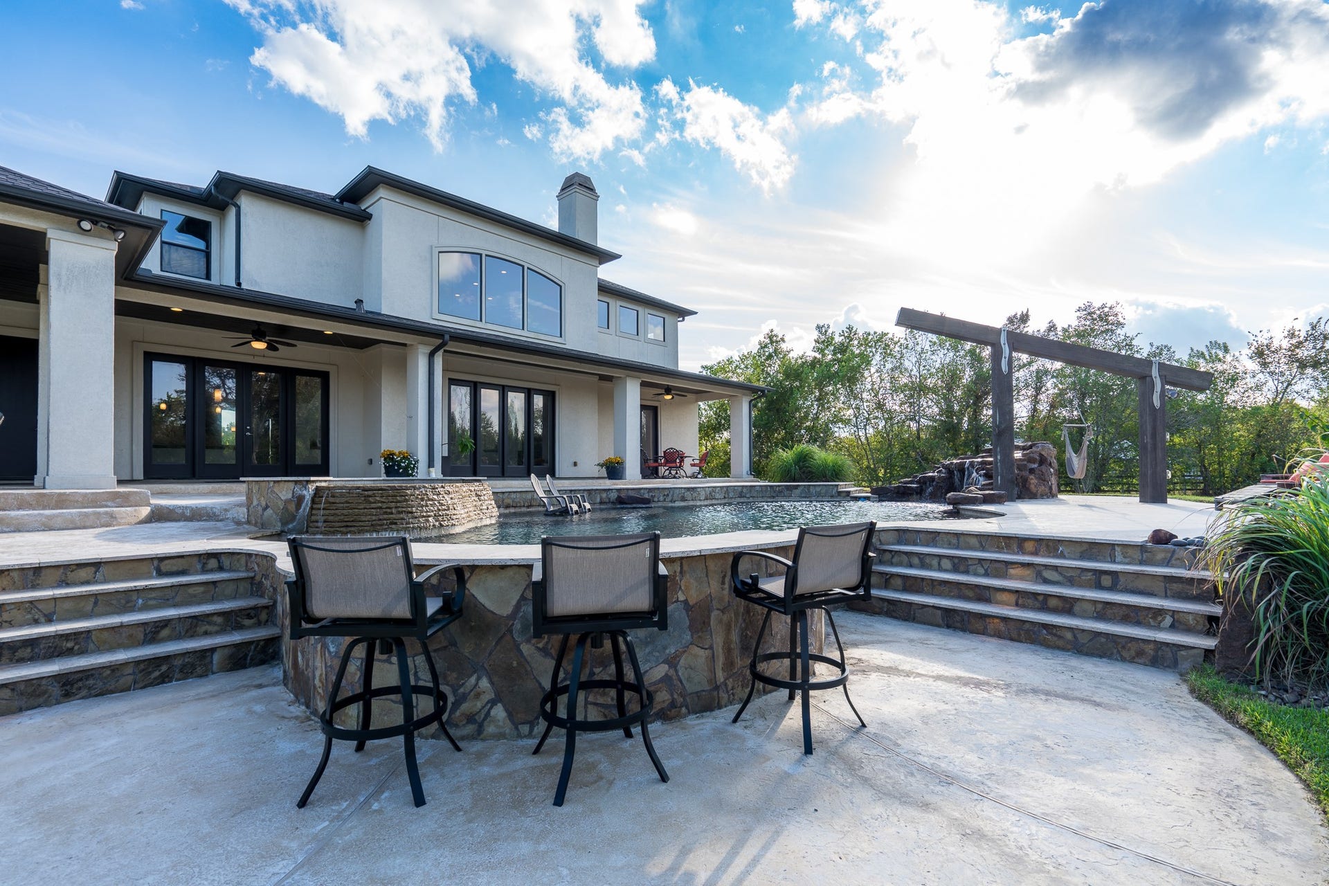 Access to the raised bar includes lighted stone stairs.